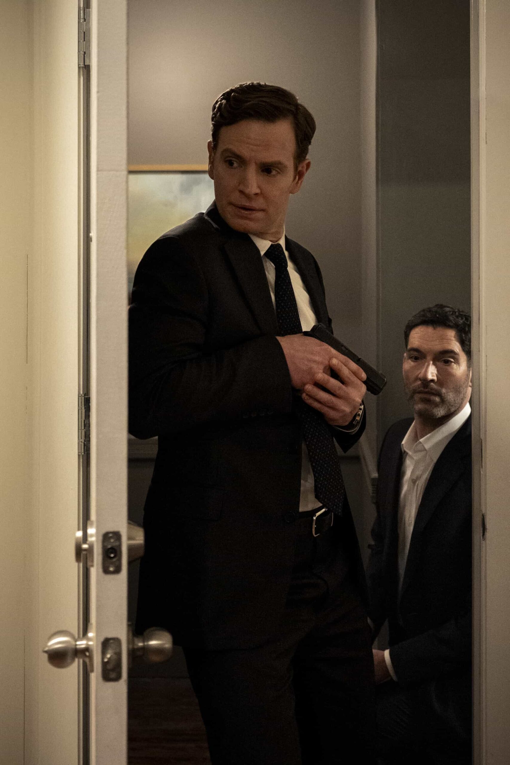 CIA Season 1 Episode 3 Picture “Bridge of Lies” – When a deeply embedded U.S. intelligence officer is detained in Hong Kong, Nikki insists on traveling there to bring him home. But when her cover is blown, the team must work tirelessly to get her back to New York, on CIA, Monday, March 9 (10:00-11:00 PM, ET/PT). Pictured (L-R): Nick Gehlfuss as Special Agent Bill Goodman and Tom Ellis as CIA Case Officer Colin Glass. Photo: Mark Schafer/CBS ©2026 CBS Broadcasting, Inc. All Rights Reserved.