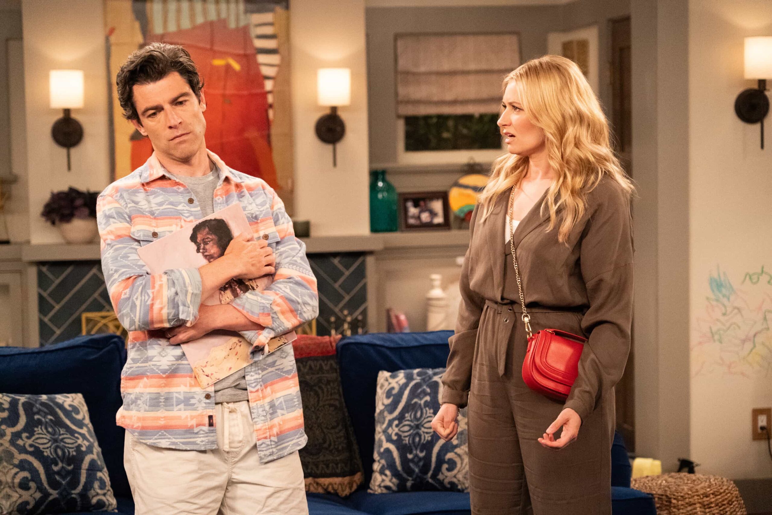 The Neighborhood Season 8 Episode 11 “Welcome to the Baby Proofing” – While Marty heads to San Diego for a tech convention and Courtney is away for the weekend, Tina’s insistence on babysitting Daphne sparks a baby-proofing fiasco that leaves Calvin and Dave unexpectedly locked inside the bathroom, on THE NEIGHBORHOOD, Pictured: Max Greenfield as Dave and Beth Behrs as Gemma. Photo: Monty Brinton/CBS ©2025 CBS Broadcasting, Inc. All Rights Reserved.