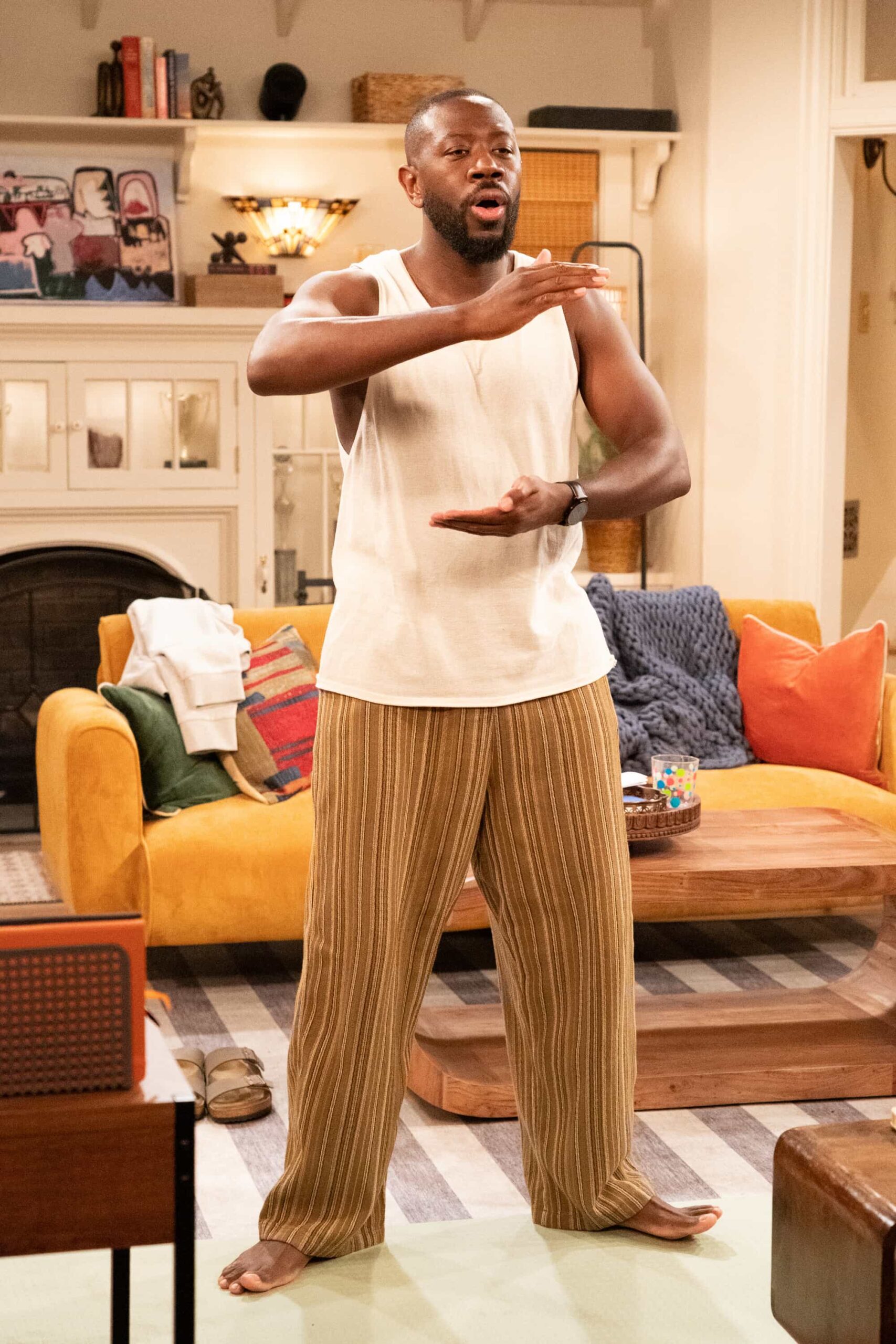 The Neighborhood Season 8 Episode 11 “Welcome to the Baby Proofing” – While Marty heads to San Diego for a tech convention and Courtney is away for the weekend, Tina’s insistence on babysitting Daphne sparks a baby-proofing fiasco that leaves Calvin and Dave unexpectedly locked inside the bathroom, on THE NEIGHBORHOOD, Pictured: Sheaun McKinney as Malcolm. Photo: Monty Brinton/CBS ©2025 CBS Broadcasting, Inc. All Rights Reserved.