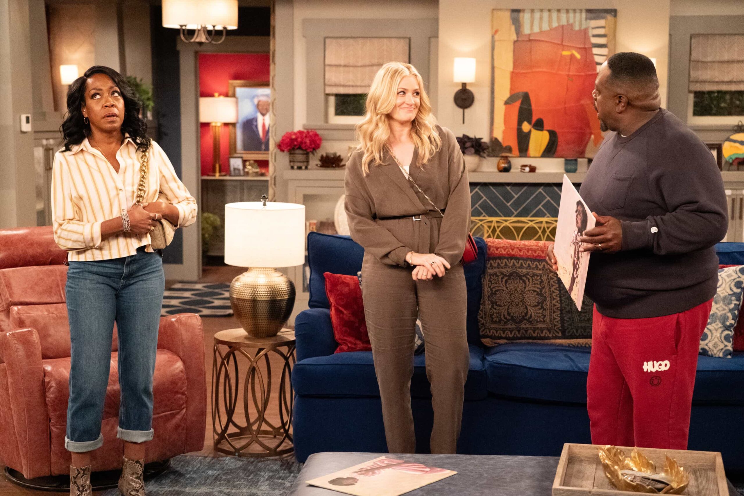 The Neighborhood Season 8 Episode 11 image “Welcome to the Baby Proofing” – While Marty heads to San Diego for a tech convention and Courtney is away for the weekend, Tina’s insistence on babysitting Daphne sparks a baby-proofing fiasco that leaves Calvin and Dave unexpectedly locked inside the bathroom, on THE NEIGHBORHOOD, Pictured: Tichina Arnold as Tina, Beth Behrs as Gemma and Cedric The Entertainer as Calvin. Photo: Monty Brinton/CBS ©2025 CBS Broadcasting, Inc. All Rights Reserved.