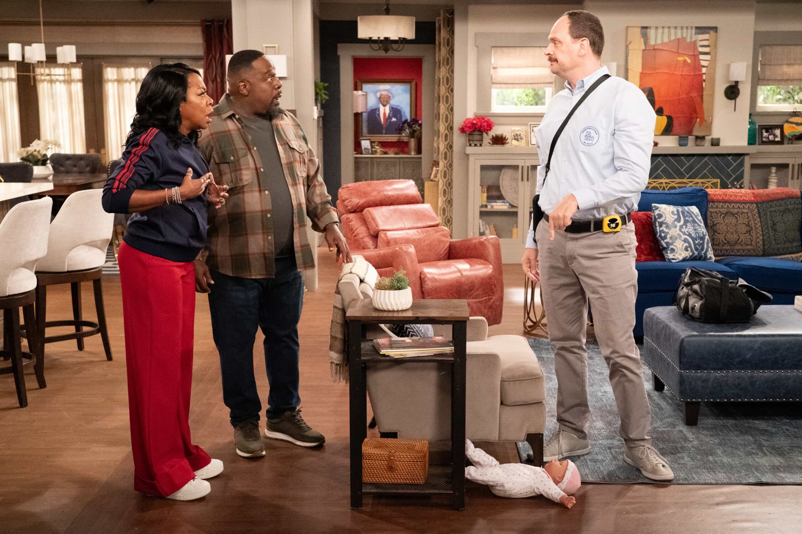 The Neighborhood Season 8 Episode 11 “Welcome to the Baby Proofing” – While Marty heads to San Diego for a tech convention and Courtney is away for the weekend, Tina’s insistence on babysitting Daphne sparks a baby-proofing fiasco that leaves Calvin and Dave unexpectedly locked inside the bathroom, on THE NEIGHBORHOOD, Pictured: Tichina Arnold as Tina, Cedric The Entertainer as Calvin and Dave Theune as Rolf. Photo: Monty Brinton/CBS ©2025 CBS Broadcasting, Inc. All Rights Reserved.