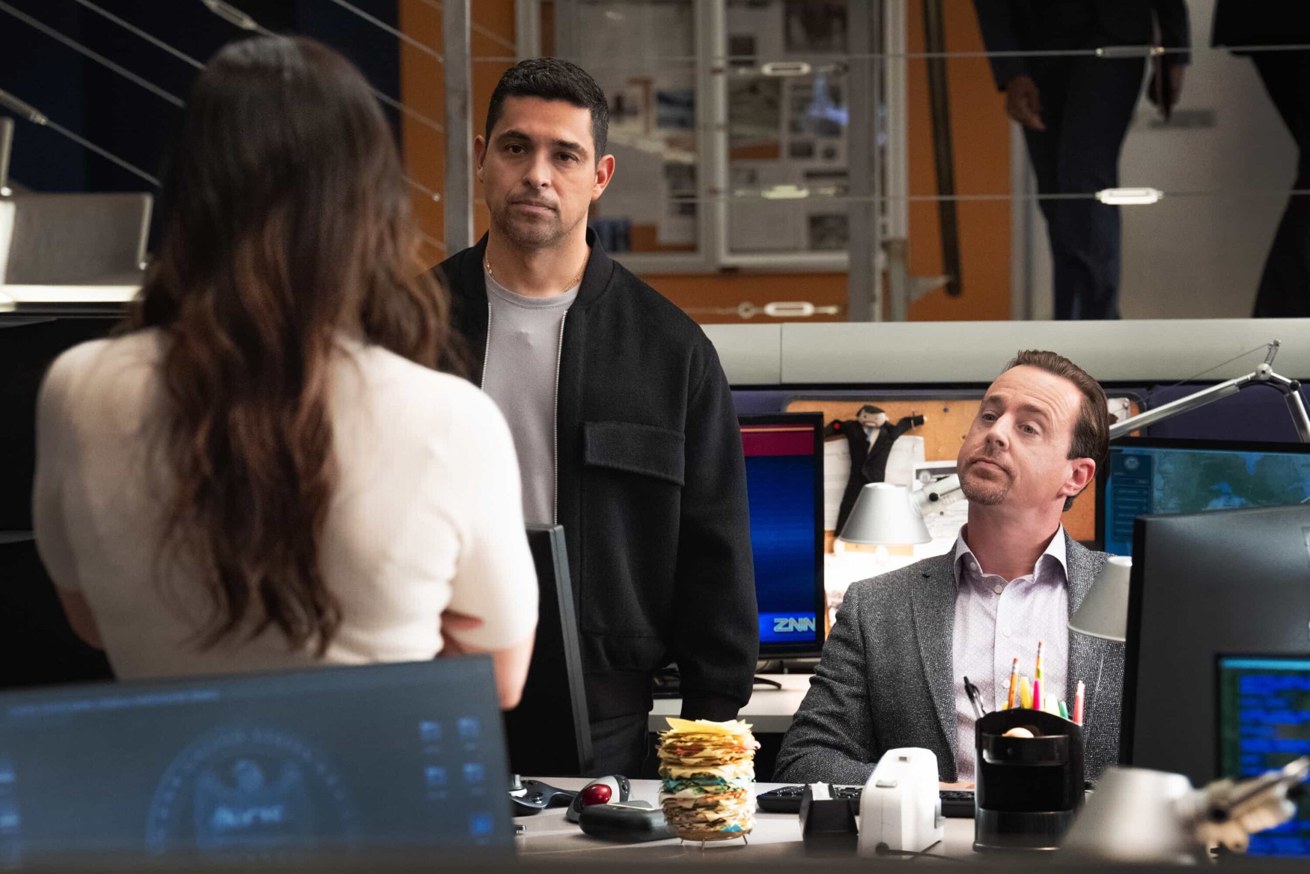 NCIS Season 23 Episode 11 Photo “Army of One” – When a desperate man barricades himself inside an ammo warehouse, Knight is the only negotiator he’ll talk to, claiming she once saved him before. As explosives tick and trust frays, Knight clashes with the CID officer running the standoff, each convinced theirs is the only way out, on the CBS Original series NCIS, Tuesday, March 10 (8:00-9:00 PM, ET/PT) on the CBS Television Network, and streaming on Paramount+     Pictured (L-R): Katrina Law as Special Agent Jessica Knight, Wilmer Valderrama as Special Agent Nicholas “Nick” Torres and Sean Murray as Special Agent Timothy McGee  Photo: Robert Voets/CBS ©2025 CBS Broadcasting, Inc. All Rights Reserved.