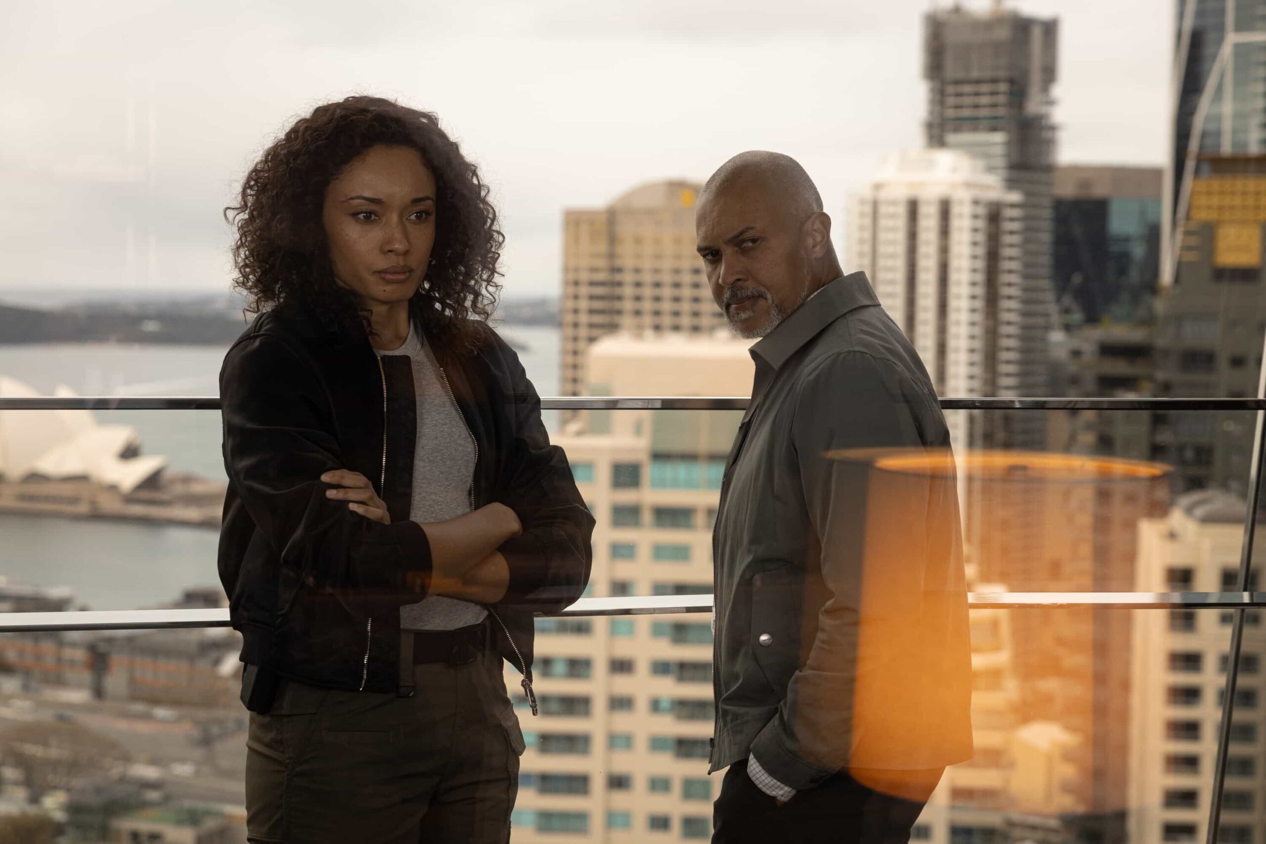 NCIS Sydney Season 3 Episode 10 Still - Olivia Swann as NCIS Special Agent Captain Michelle Mackey and Bert La Bonté as Special Agent Ken Carter in NCIS: Sydney episode 10, season 3 streaming on Paramount+, 2026. Photo Credit:  Daniel Asher Smith/Paramount+   © TM & © 2026 CBS Studios Inc. NCIS: Sydney and related marks and logos  are trademarks of CBS Studios Inc. All Rights Reserved.