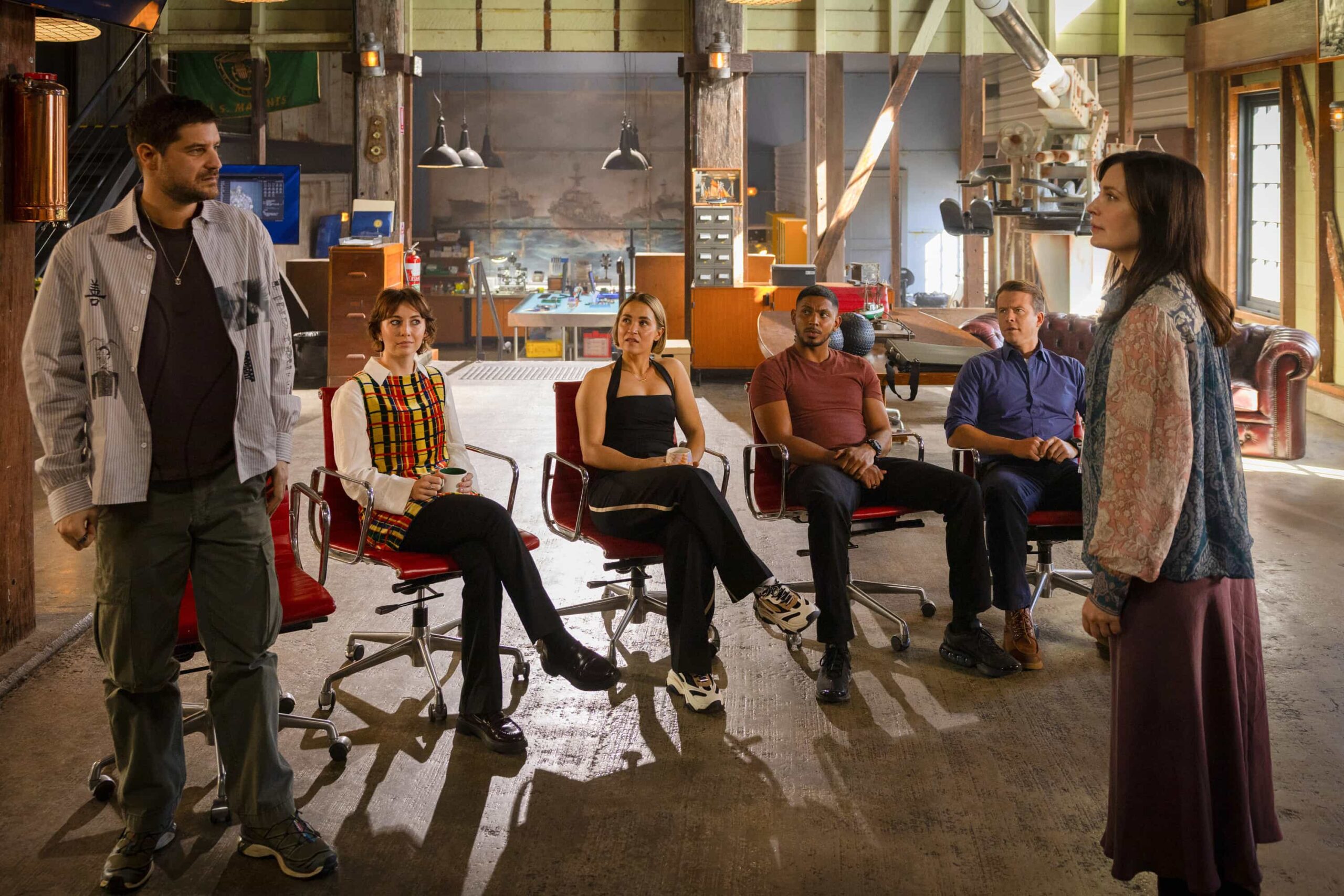 NCIS Sydney Season 3 Episode 10 - L-R: Claude Jabbour as Travis “Trigger” Riggs, Mavournee Hazel as Forensic Pathologist Bluebird \'Blue\' Gleeson, Tuuli Narkle as AFP Liaison Officer Constable Evie Cooper, Sean Sagar as NCIS Special Agent DeShawn Jackson, Todd Lasance as AFP Liaison Officer Sergeant Jim \'JD\' Dempsey, and Annie Maynard as Janelle  in NCIS: Sydney episode 10, season 3 streaming on Paramount+, 2026. Photo Credit:  Daniel Asher Smith/Paramount+   © TM & © 2026 CBS Studios Inc. NCIS: Sydney and related marks and logos  are trademarks of CBS Studios Inc. All Rights Reserved.