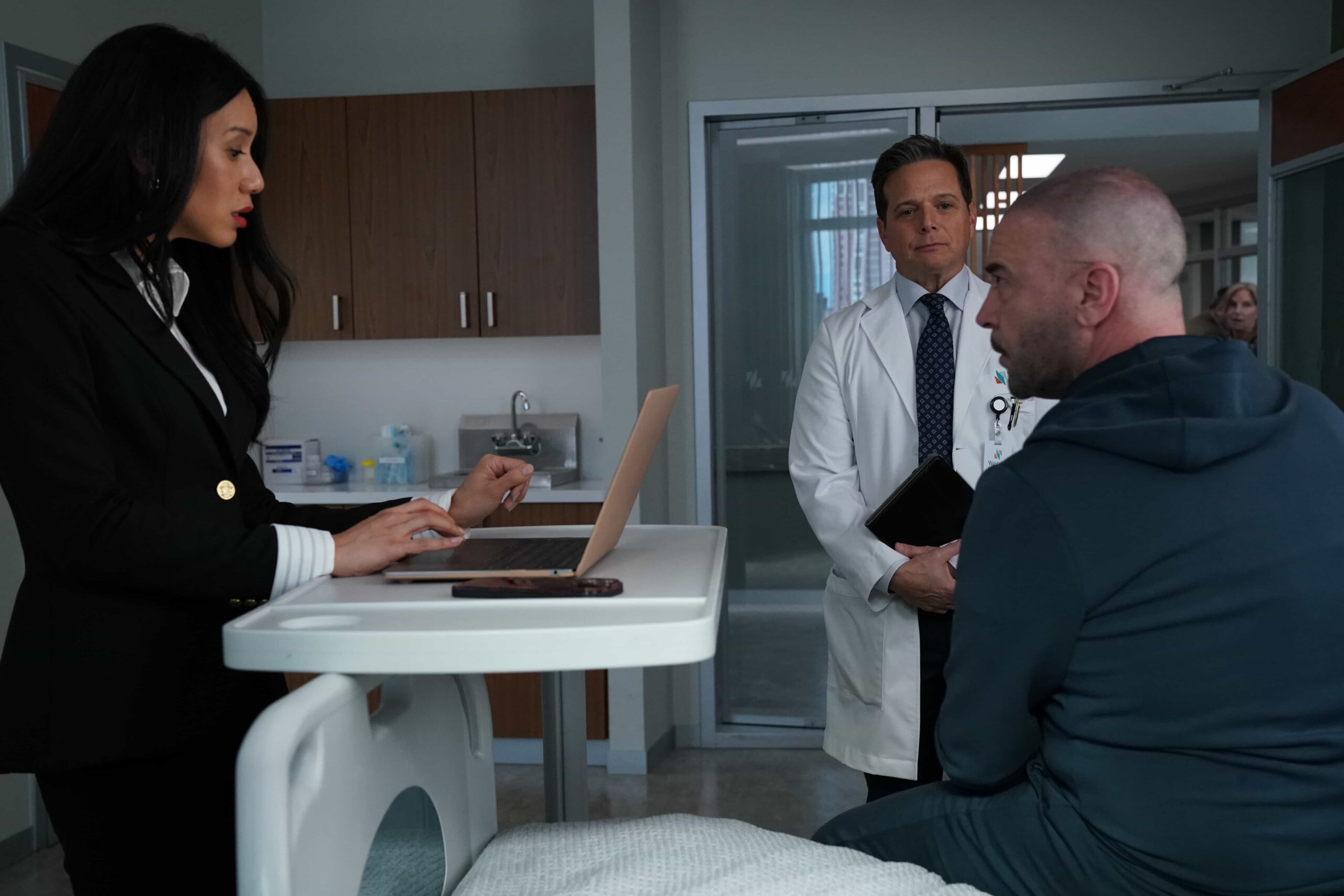 DOC Season 2 Episode 17 Image : L-R: Elena Juatco, Scott Wolf, and Alan Van Sprang in the "Good Hands" episode of DOC airing Tuesday, Mar. 10 (9:00-10:00 PM ET/PT) on FOX. CR: John Medland/FOX. ©2026 FOX Media LLC.