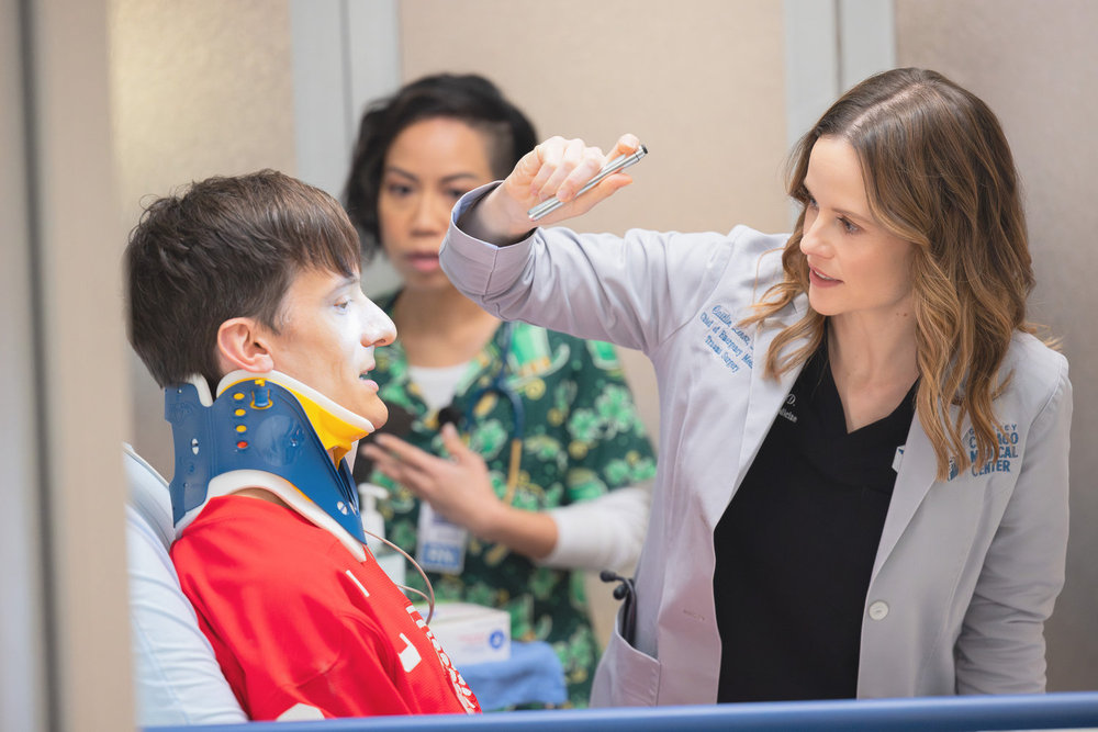 CHICAGO MED -- "Twist & Shout" Episode 1114 -- Pictured: (l-r) Paul Culos as Tim Freitag, Sarah Ramos as Dr. Caitlin Lenox -- (Photo by: George Burns Jr/NBC)