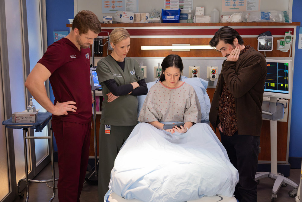 CHICAGO MED Season 11 Episode 14 Photo -- "Twist & Shout" Episode 1114 -- Pictured: (l-r) Luke Mitchell as Dr. Mitch Ripley, Jessy Schram as Dr. Hannah Asher, Aleksa Palladino as Maddie Thomas, Jeff Adler as Grant Thomas -- (Photo by: George Burns Jr/NBC)