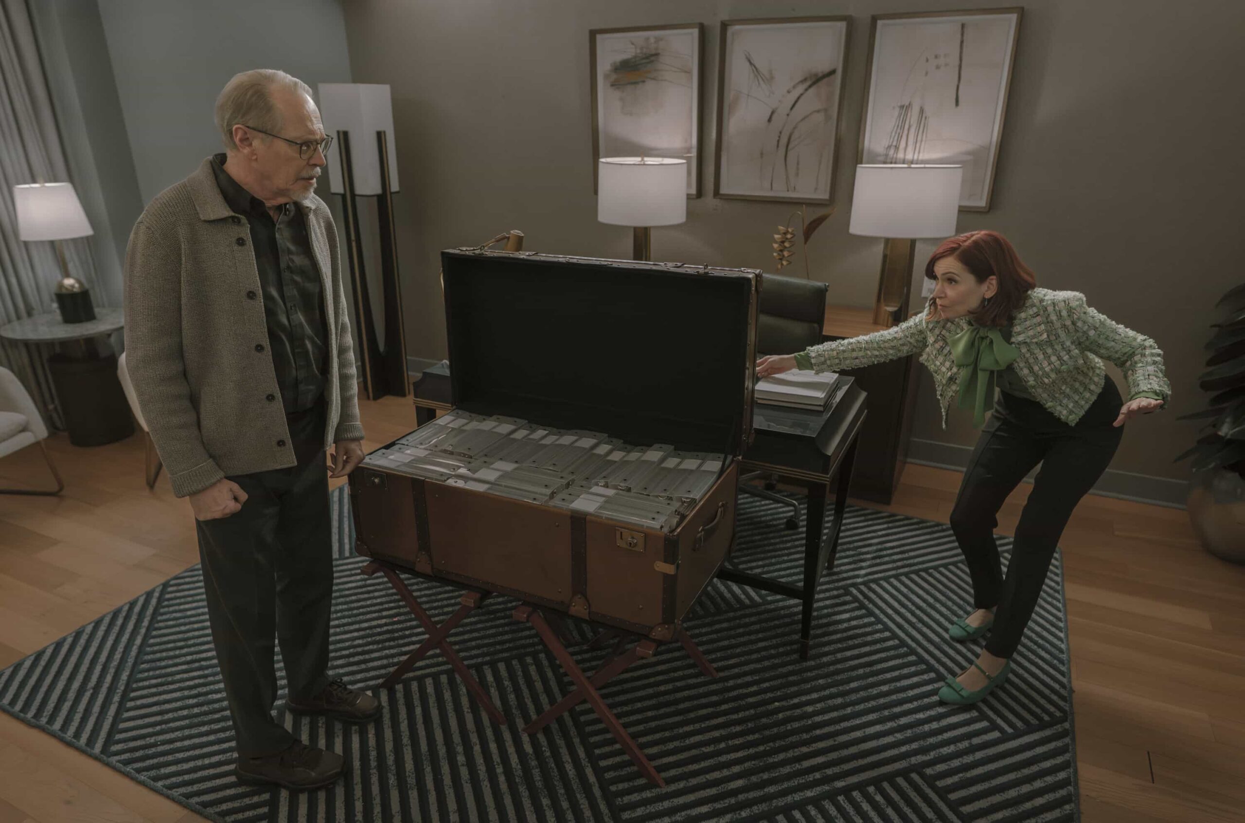 “Murder Six Across” – After the famed editor of the daily puzzle is murdered at the annual crossword championship, Elsbeth infiltrates the world of elite puzzle solvers to find the champion who will do whatever it takes to win, on ELSBETH, Thursday, March 12 (10:00-11:00 PM, ET/PT) on the CBS Television Network, and streaming on Paramount+   Pictured (L-R): Steve Buscemi as Simon Craigie, Carrie Preston as Elsbeth Tascioni, and Micaela Diamond as Det. Samantha Edwards    Photo: Michael Parmelee/CBS ©2025 CBS Broadcasting, Inc. All Rights Reserved.