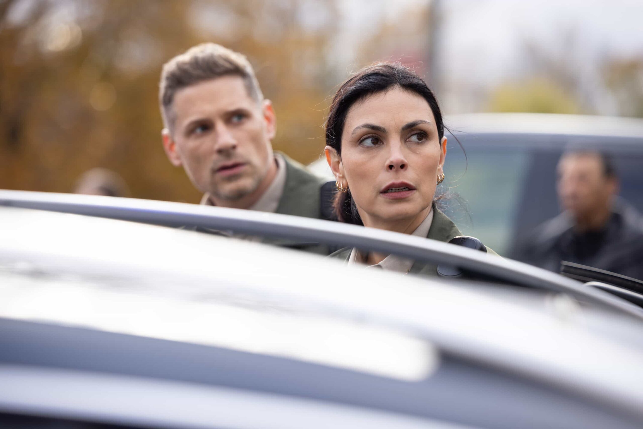 Sheriff Country Season 1 Episode 12 Still "Plus One" -- Coverage of the CBS Original Series SHERIFF COUNTRY, scheduled to air on the CBS Television Network.  Pictured: Matt Lauria as Boone and Morena Baccarin as Sheriff Mickey Fox. Photo: Darren Goldstein/CBS ©2025 CBS Broadcasting, Inc. All Rights Reserved.