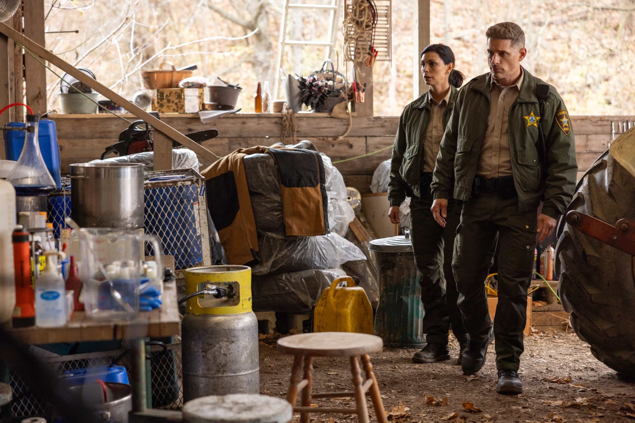 "Plus One" -- Coverage of the CBS Original Series SHERIFF COUNTRY, scheduled to air on the CBS Television Network.  Pictured: Morena Baccarin as Sheriff Mickey Fox and Matt Lauria as Boone. Photo: Darren Goldstein/CBS ©2025 CBS Broadcasting, Inc. All Rights Reserved.