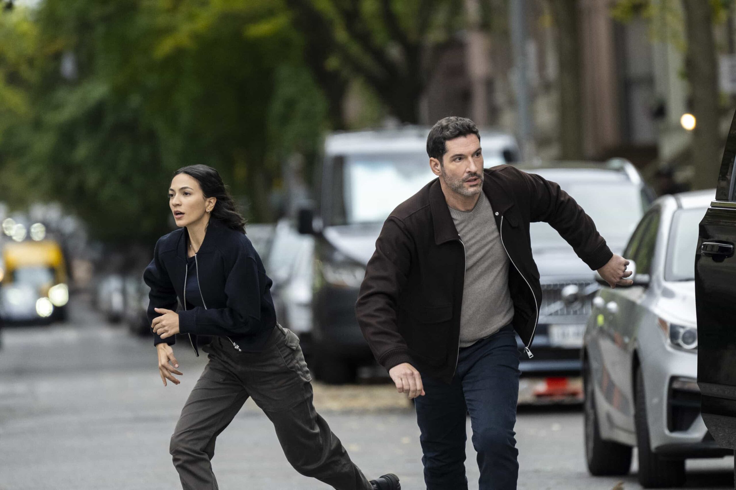 CIA Season 1 Episode 4 Still “Forced Labor” – When a wanted Belarusian national is discovered posing as an expecting father, Colin and Bill work to expose an international illegal baby smuggling ring. Meanwhile, Bill worries about his father’s health back home, on CIA, Monday, March 16 (10:00-11:00 PM, ET/PT).  Pictured (L-R): Natalee Linez as CIA Analyst Gina Gosian  and Tom Ellis as CIA Case Officer Colin Glass. Photo: Mark Schafer/CBS ©2026 CBS Broadcasting, Inc. All Rights Reserved.