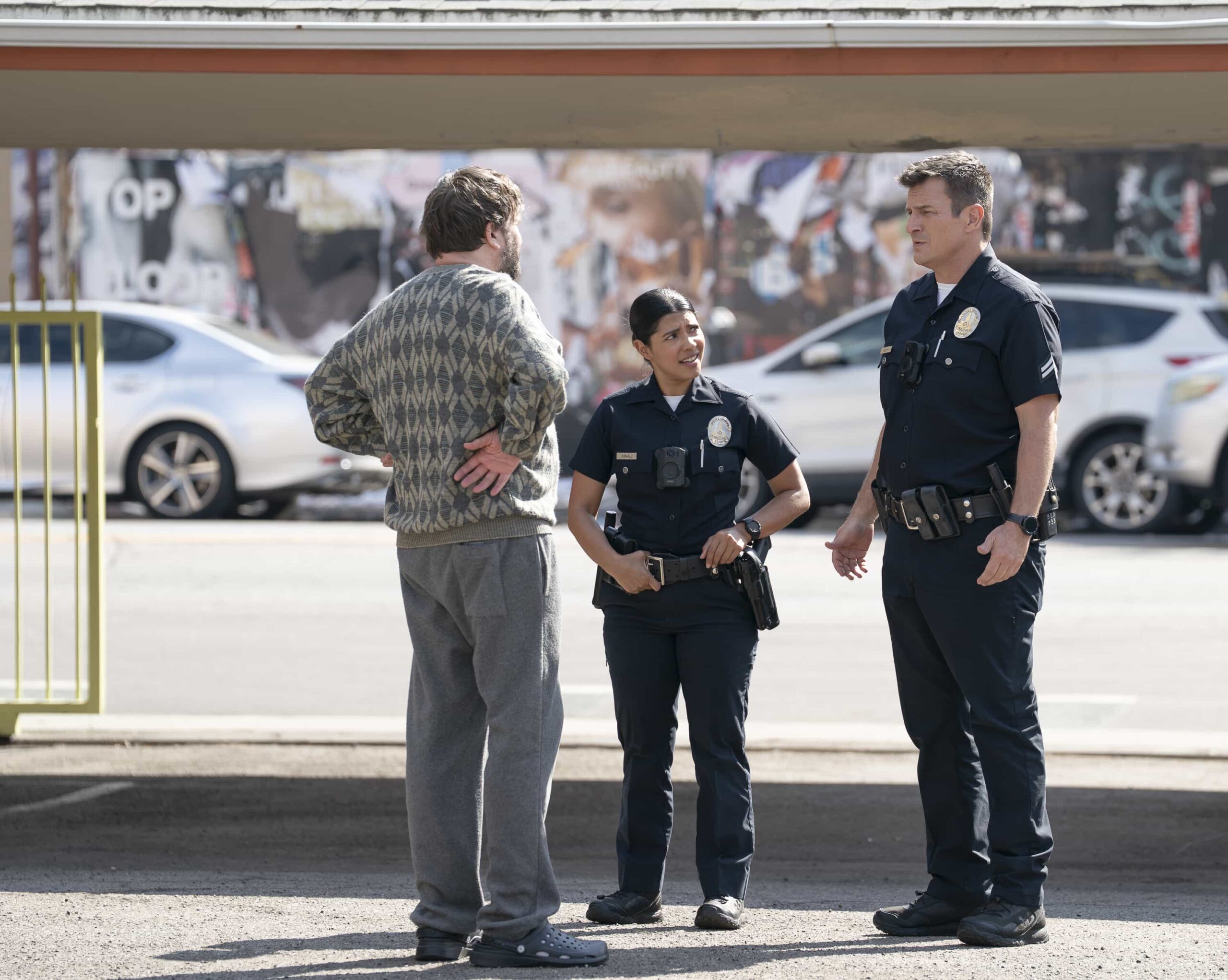 THE ROOKIE Season 8 Episode 11 - “Aftermath” - Lucy returns to work in the aftermath of the attack. Meanwhile, an unexpected twist hinders the Liam Glasser case, and a familiar face helps the team track down a killer. MONDAY, MARCH 16 (10:00-11:00 p.m. EDT) on ABC. (Disney/Mike Taing) 
LISSETH CHAVEZ, NATHAN FILLION