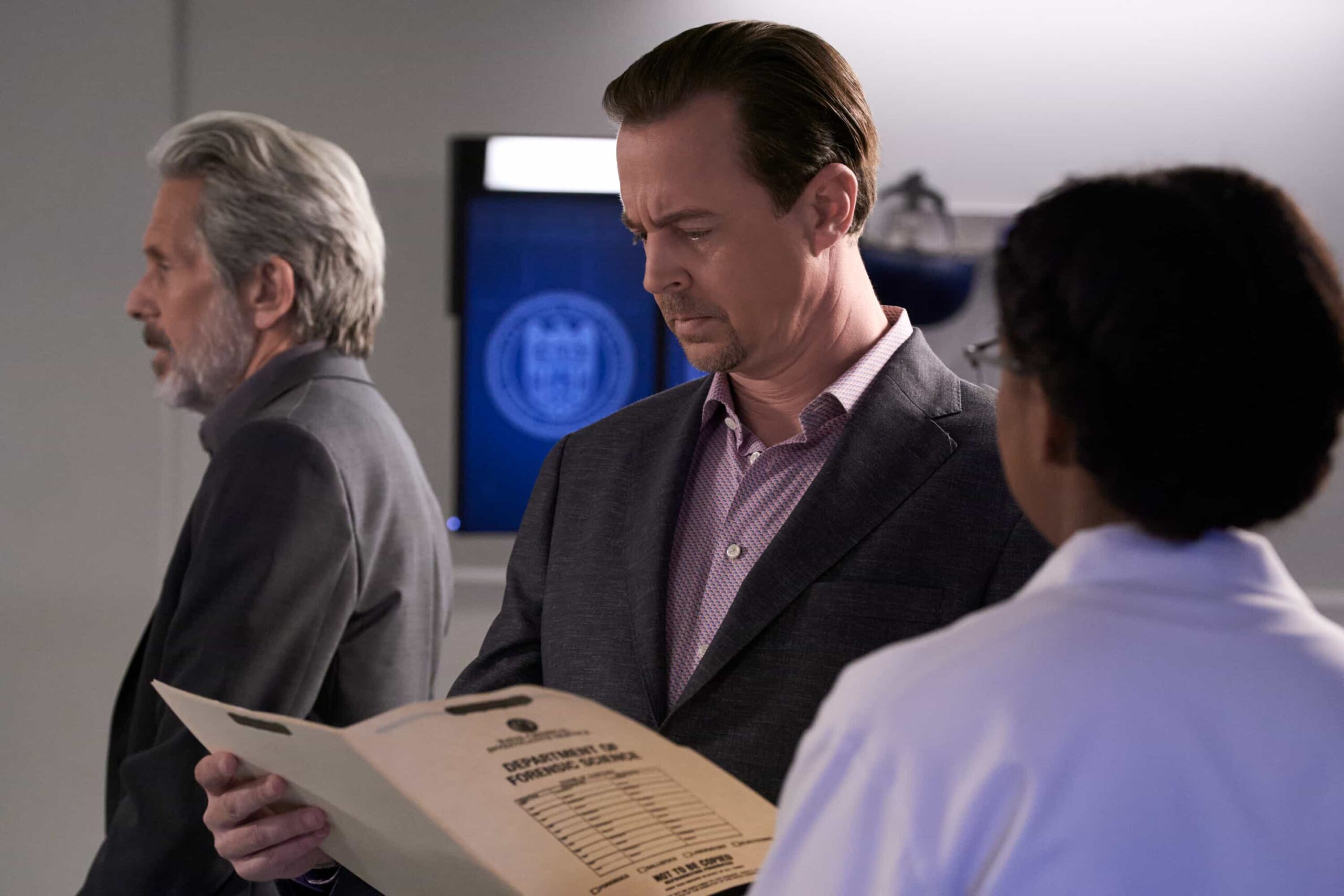 NCIS Season 23 Episode 12 Promo -"In Too Deep"-     Pictured (L-R): Gary Cole as Special Agent Alden Parker, and Sean Murray as Special Agent Timothy McGee, and Diona Reasonover as Kasie Hines   Photo credit: Michael Yarish/2025 CBS Entertainment Inc. All Rights Reserved.