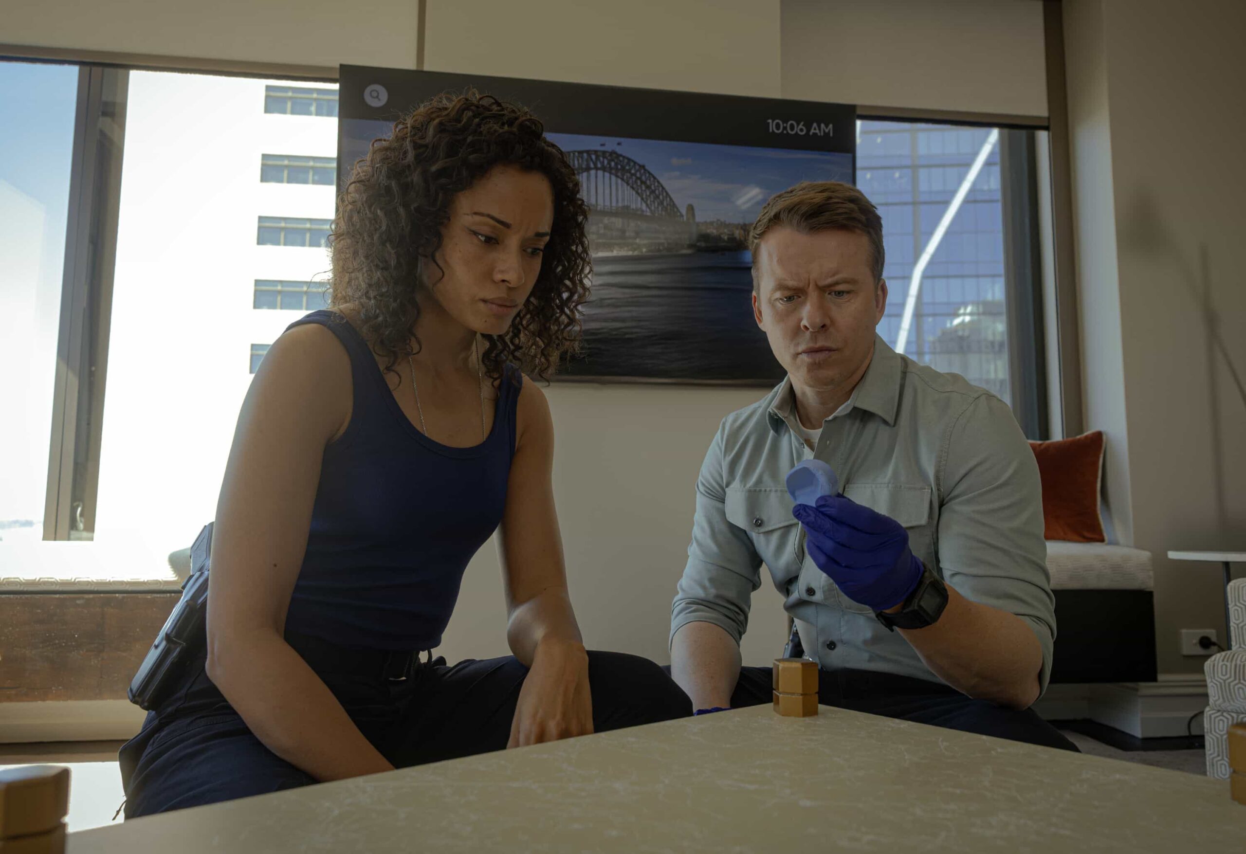 NCIS Sydney Season 3 Episode 11 Photo - Olivia Swann as NCIS Special Agent Captain Michelle Mackey and Todd Lasance as AFP Liaison Officer Sergeant Jim \'JD\' Dempsey in NCIS: Sydney episode 11, season 3 streaming on Paramount+, 2026. Photo Credit:  Daniel Asher Smith/Paramount+