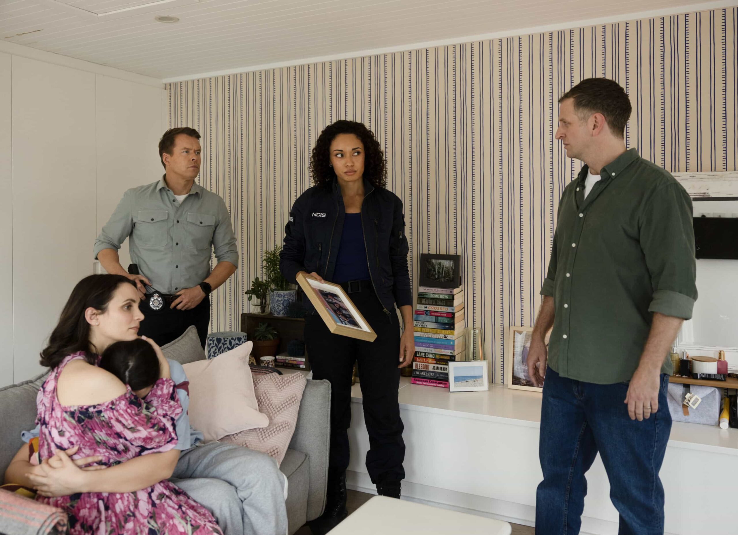 NCIS Sydney Season 3 Episode 11 Still -L-R: Jessica Tovey as Alycia Williams, Masha Basman as Chloe Simpson, Todd Lasance as AFP Liaison Officer Sergeant Jim \'JD\' Dempsey, Olivia Swann as NCIS Special Agent Captain Michelle Mackey, and Aaron Glenane as David Williams in NCIS: Sydney episode 11, season 3 streaming on Paramount+, 2026. Photo Credit:  Daniel Asher Smith/Paramount+