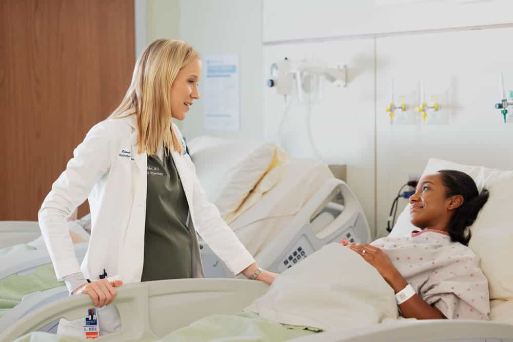 CHICAGO MED Season 11 Episode 15 Picture -- "The Cost of Living" Episode 1115 -- Pictured: Jessy Schram as Dr. Hannah Asher -- (Photo by: George Burns Jr/NBC)