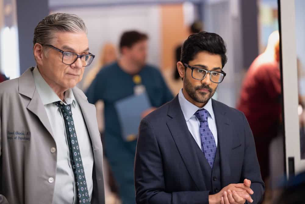 CHICAGO MED Season 11 Episode 15 Promo -- "The Cost of Living" Episode 1115 -- Pictured: (l-r) Oliver Platt as Dr. Daniel Charles, Manish Dayal as Dr. Theo Rabari -- (Photo by: George Burns Jr/NBC)