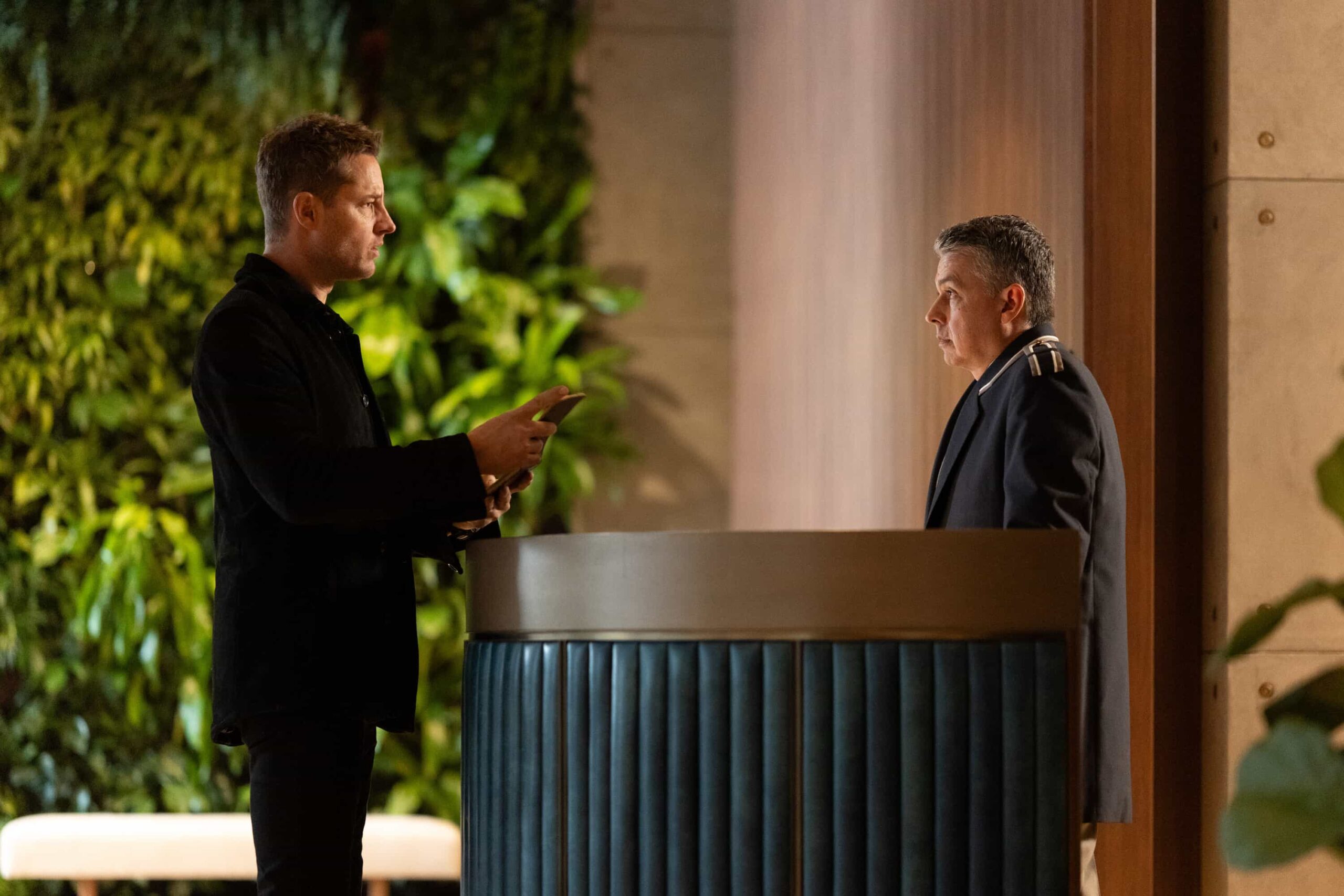 Tracker Season 3 Episode 13 “Breakaway” – After Baxter, a veteran stuntman, disappears following a risky stunt, his girlfriend, Laura, calls Colter to investigate a B-movie set, uncovering shady producers and a trail that leads into a dangerous underground world. Pictured:Justin Hartley as Colter Shaw and Andy Canete as Doorman. Photo: Darko Sikman/CBS ©2025 CBS Broadcasting, Inc. All Rights Reserved.