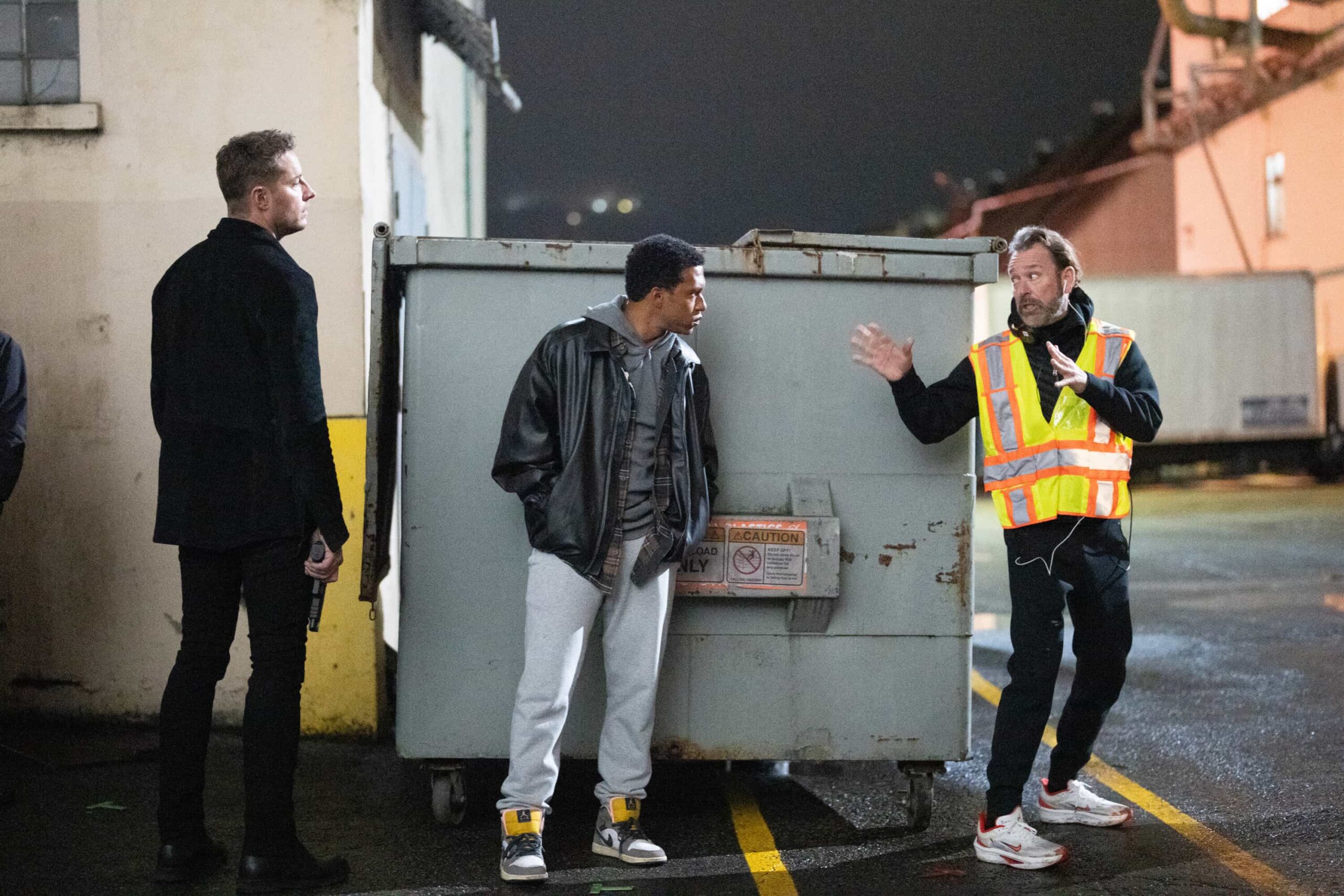 BTS “Breakaway” – After Baxter, a veteran stuntman, disappears following a risky stunt, his girlfriend, Laura, calls Colter to investigate a B-movie set, uncovering shady producers and a trail that leads into a dangerous underground world. Pictured: Justin Hartley, Lovell Adams-Gray and Director David M. Barrett. Photo: David Bukach/CBS ©2025 CBS Broadcasting, Inc. All Rights Reserved.