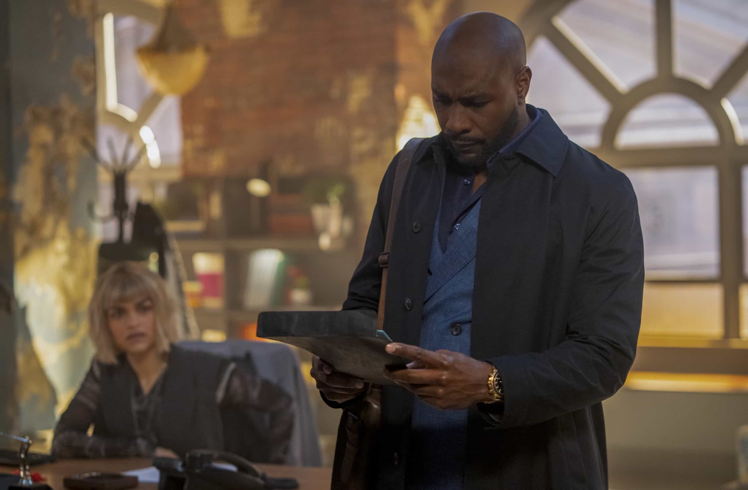 Watson Season 2 Episode 14 Photo “Wrongful Life” - Watson is sued for Wrongful Life by a long-term patient suffering from VACTERL association, who has to undergo multiple painful surgeries after a freak accident breaks his back, on WATSON, Sunday, March 22 (10:00-11:00 PM, ET/PT) on the CBS Television Network, and streaming on Paramount+*  Pictured (L-R): Eve Harlow as Dr. Ingrid Derian and Morris Chestnut as Dr. John Watson   Photo: Colin Bentley/CBS ©2025 CBS Broadcasting, Inc. All Rights Reserved.