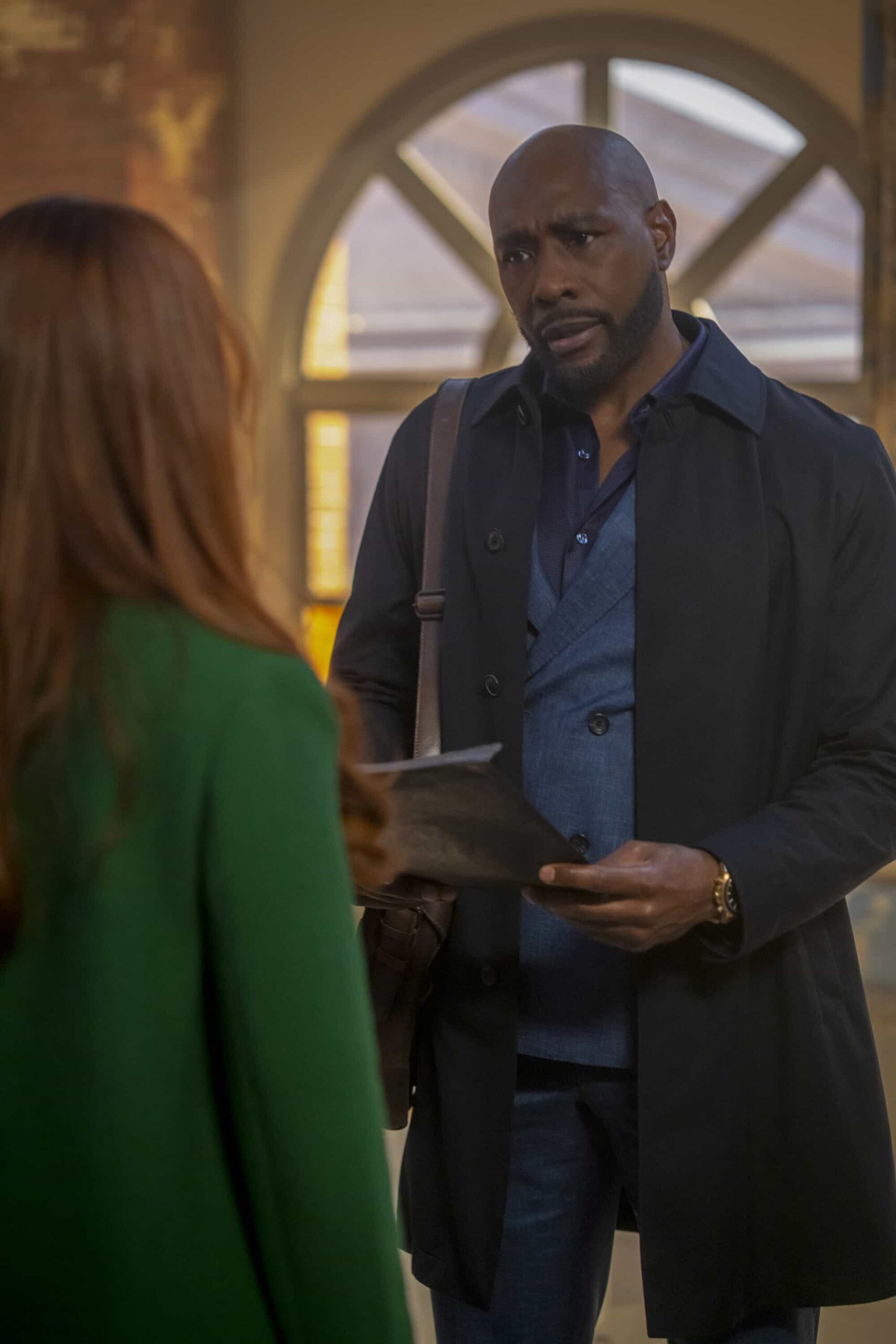 Watson Season 2 Episode 14 Promo “Wrongful Life” - Watson is sued for Wrongful Life by a long-term patient suffering from VACTERL association, who has to undergo multiple painful surgeries after a freak accident breaks his back, on WATSON, Sunday, March 22 (10:00-11:00 PM, ET/PT) on the CBS Television Network, and streaming on Paramount+*  Pictured (L-R): Aleksandra Koel as Nicely Dressed Woman and Morris Chestnut as Dr. John Watson   Photo: Colin Bentley/CBS ©2025 CBS Broadcasting, Inc. All Rights Reserved.