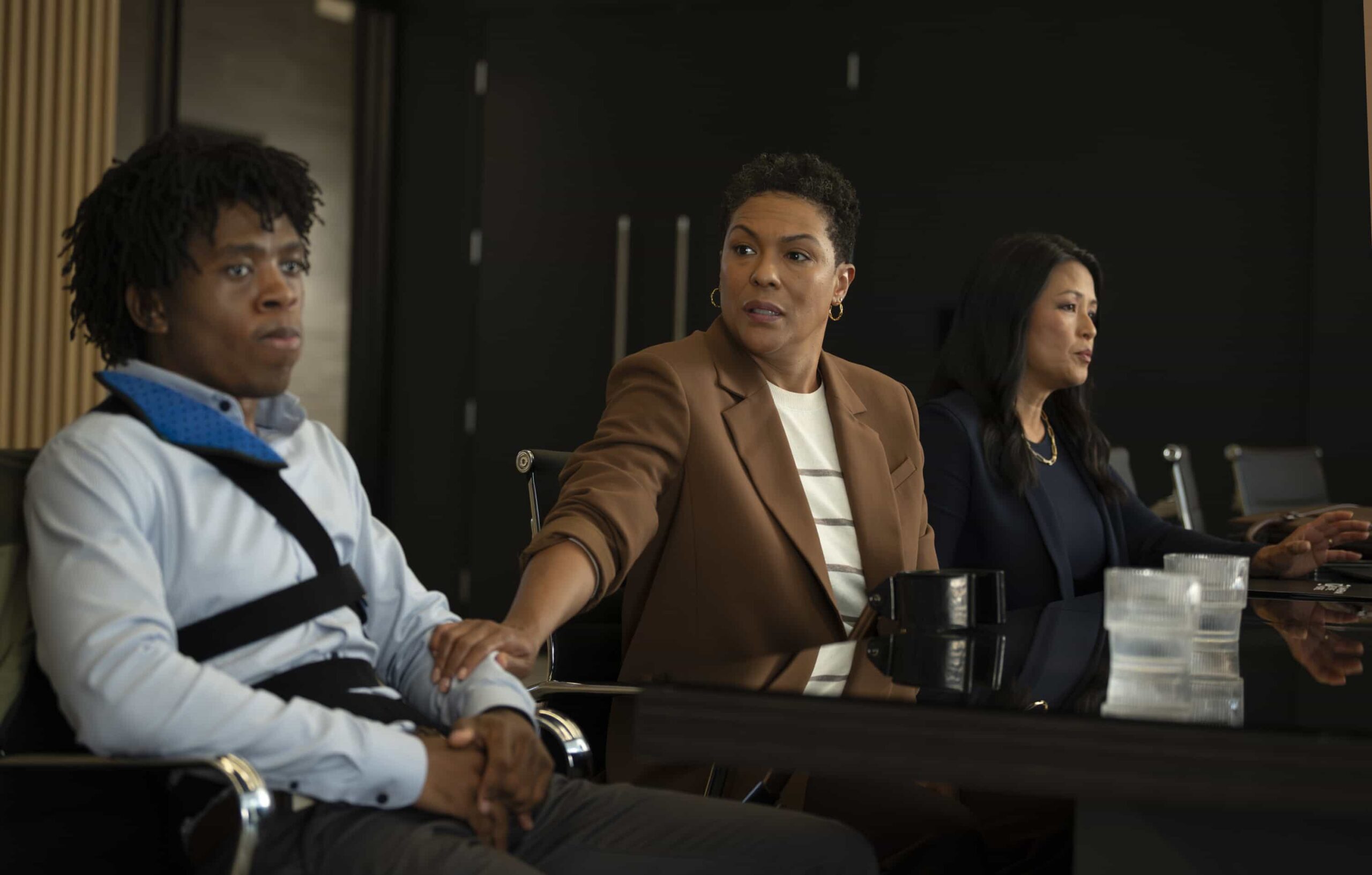 Watson Season 2 Episode 14 “Wrongful Life” - Watson is sued for Wrongful Life by a long-term patient suffering from VACTERL association, who has to undergo multiple painful surgeries after a freak accident breaks his back, on WATSON, Sunday, March 22 (10:00-11:00 PM, ET/PT) on the CBS Television Network, and streaming on Paramount+*   Pictured (L-R): Tamela Mpumlwana as Kyren Garner, April Parker Jones as Marlis Garner, and Theresa Wong as Georgia Tannerman   Photo: Sergei Bachlakov/CBS ©2025 CBS Broadcasting, Inc. All Rights Reserved.