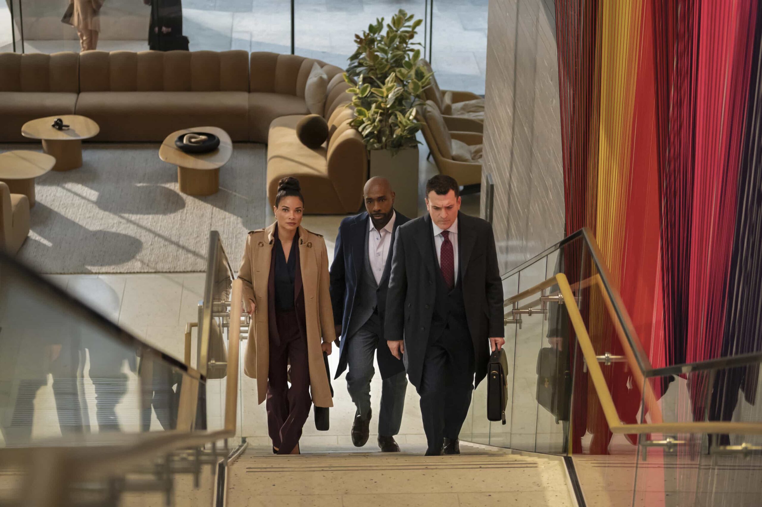 “Wrongful Life” - Watson is sued for Wrongful Life by a long-term patient suffering from VACTERL association, who has to undergo multiple painful surgeries after a freak accident breaks his back, on WATSON, Sunday, March 22 (10:00-11:00 PM, ET/PT) on the CBS Television Network, and streaming on Paramount+*  Pictured (L-R):  Rochelle Aytes as Dr. Mary Morstan, Morris Chestnut as Dr. John Watson, and Paul Du Toit as Charles Morgan  Photo: Sergei Bachlakov/CBS ©2025 CBS Broadcasting, Inc. All Rights Reserved.