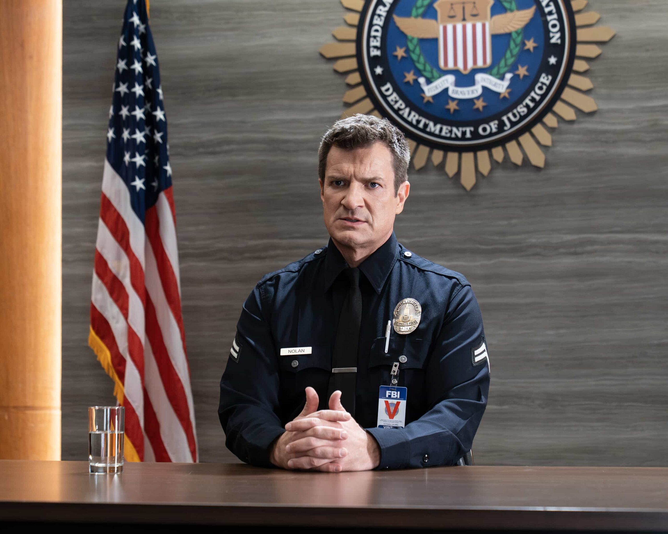 THE ROOKIE Season 8 Episode 12 Picture - “Spy Games” - The FBI and LAPD join forces on a covert sting operation to protect Bailey, while Wesley and Angela face tensions in their marriage when his campaign is threatened by a public scandal. MONDAY, MARCH 23 (10:00-11:00 p.m. EDT) on ABC. (Disney/Mike Taing) 
NATHAN FILLION