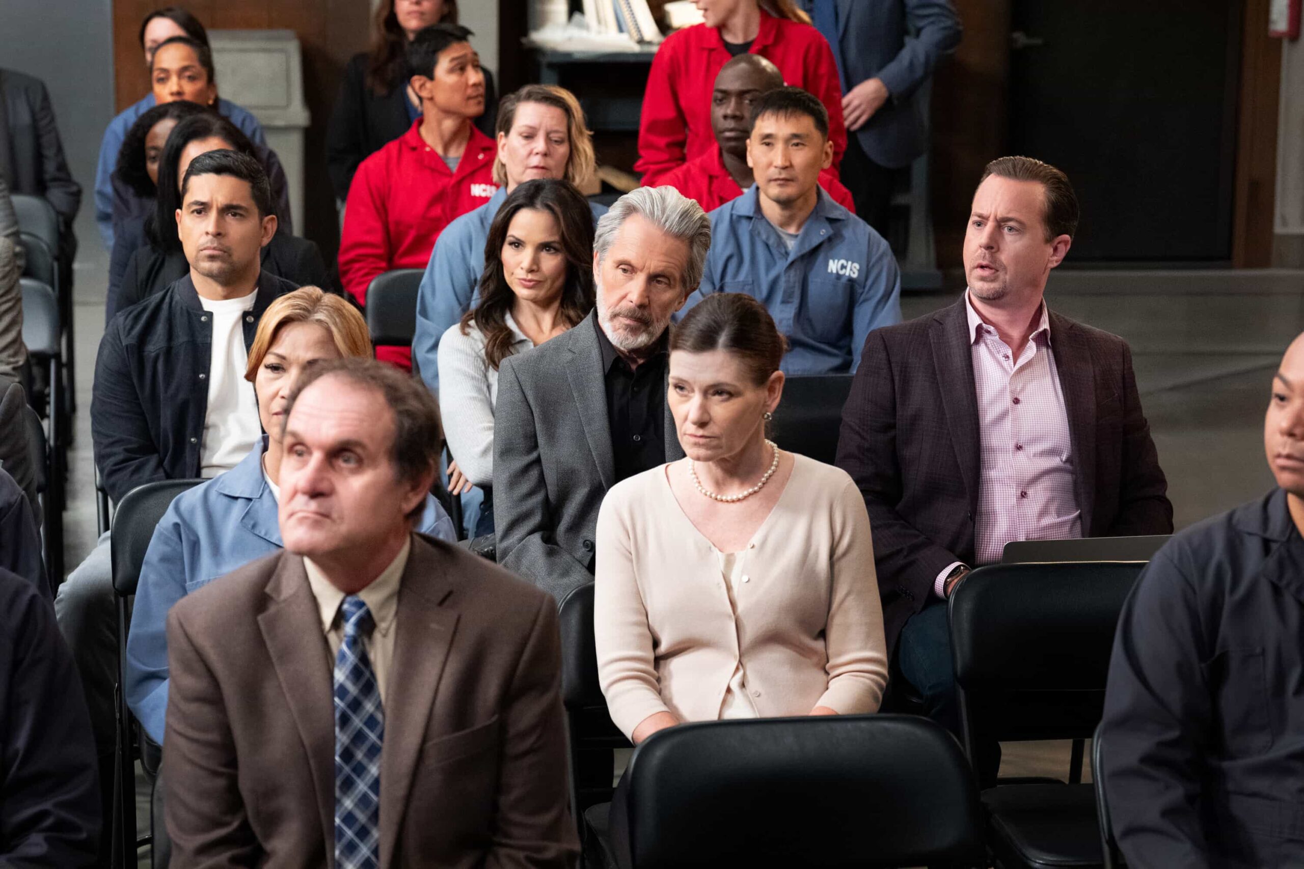 NCIS Season 23 Episode 13 Promo - “All Good Things” – When the son of a Marine that Gibbs once helped comes to NCIS in desperation, the fractured team reunites off the books. But chasing justice without a badge may cost them more than their careers, on the 500th episode of the CBS Original series NCIS, Tuesday, March 24 (8:00-9:00 PM, ET/PT) on the CBS Television Network.  Pictured (L-R): Sean Murray as Timothy McGee, Gary Cole as Alden Parker, Wilmer Valderrama as Nick Torres, Katrina Law as Jessica Knight, Rocky Carroll as Leon Vance, Brian Dietzen as Jimmy Palmer and Diona Reasonover as Kasie Hines.  Photo: Robert Voets/CBS  ©2026 CBS Broadcasting, Inc. All Rights Reserved.