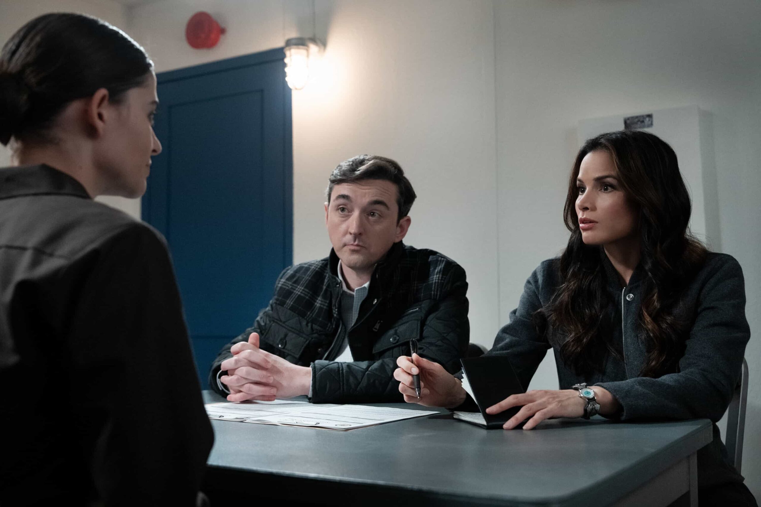 NCIS Season 23 Episode 13 - “All Good Things” – When the son of a Marine that Gibbs once helped comes to NCIS in desperation, the fractured team reunites off the books. But chasing justice without a badge may cost them more than their careers, on the 500th episode of the CBS Original series NCIS, Tuesday, March 24 (8:00-9:00 PM, ET/PT) on the CBS Television Network.  Pictured (L-R): Sean Murray as Timothy McGee, Gary Cole as Alden Parker, Wilmer Valderrama as Nick Torres, Katrina Law as Jessica Knight, Rocky Carroll as Leon Vance, Brian Dietzen as Jimmy Palmer and Diona Reasonover as Kasie Hines.  Photo: Robert Voets/CBS  ©2026 CBS Broadcasting, Inc. All Rights Reserved.