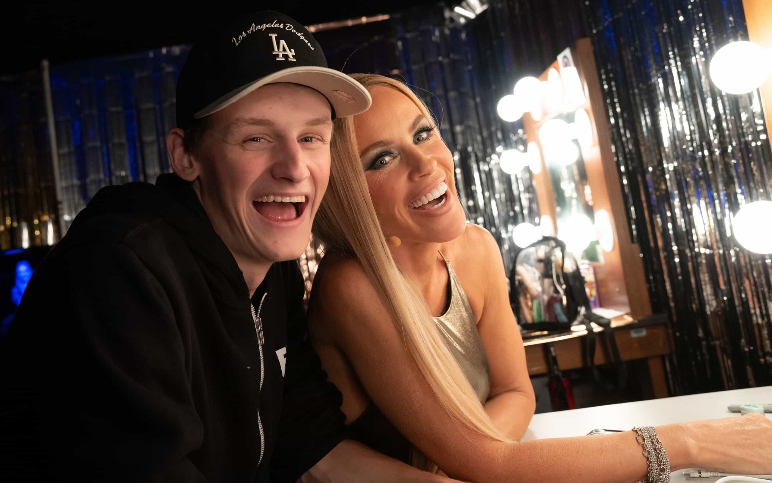 THE MASKED SINGER Season 14 Episode 12: L-R: Evan Asher and Jenny McCarthy Wahlberg on "Semi-Finals" episode of THE MASKED SINGER airing Wednesday, Mar. 25 (8:00-9 PM ET/PT) on FOX. ©2026 Fox Media LLC. CR: Trae Patton/ FOX.