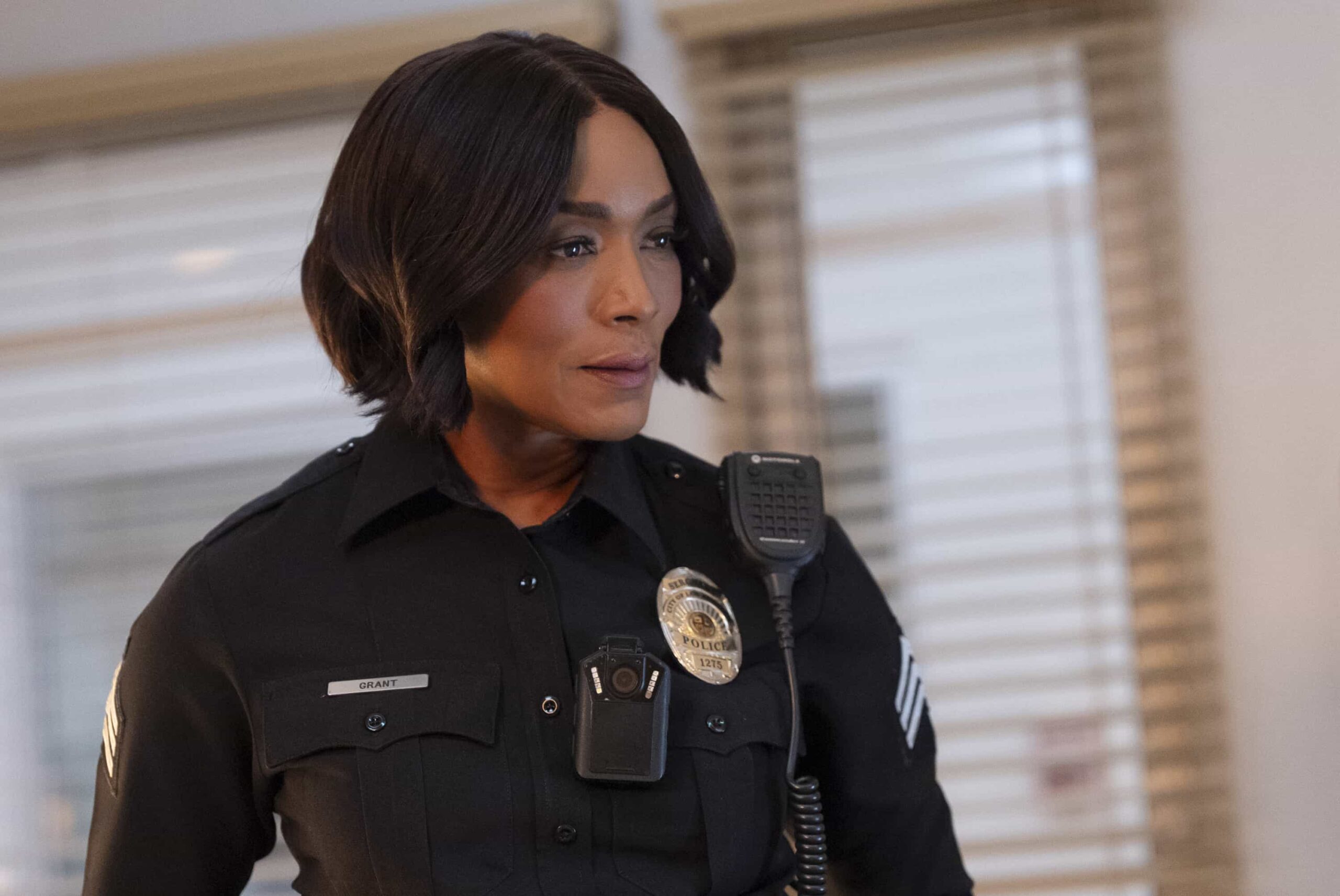 9-1-1 Season 9 Episode 15 Photo - “Pick Your Poison” - Athena is pulled into a mysterious murder investigation when a man arrives at the station to report his own death. Meanwhile, the 118 races to the site of a car crash involving a mother and son. THURSDAY, MARCH 26 (8:00-9:00 p.m. EDT) on ABC.  (Disney/Christopher Willard) 
ANGELA BASSETT