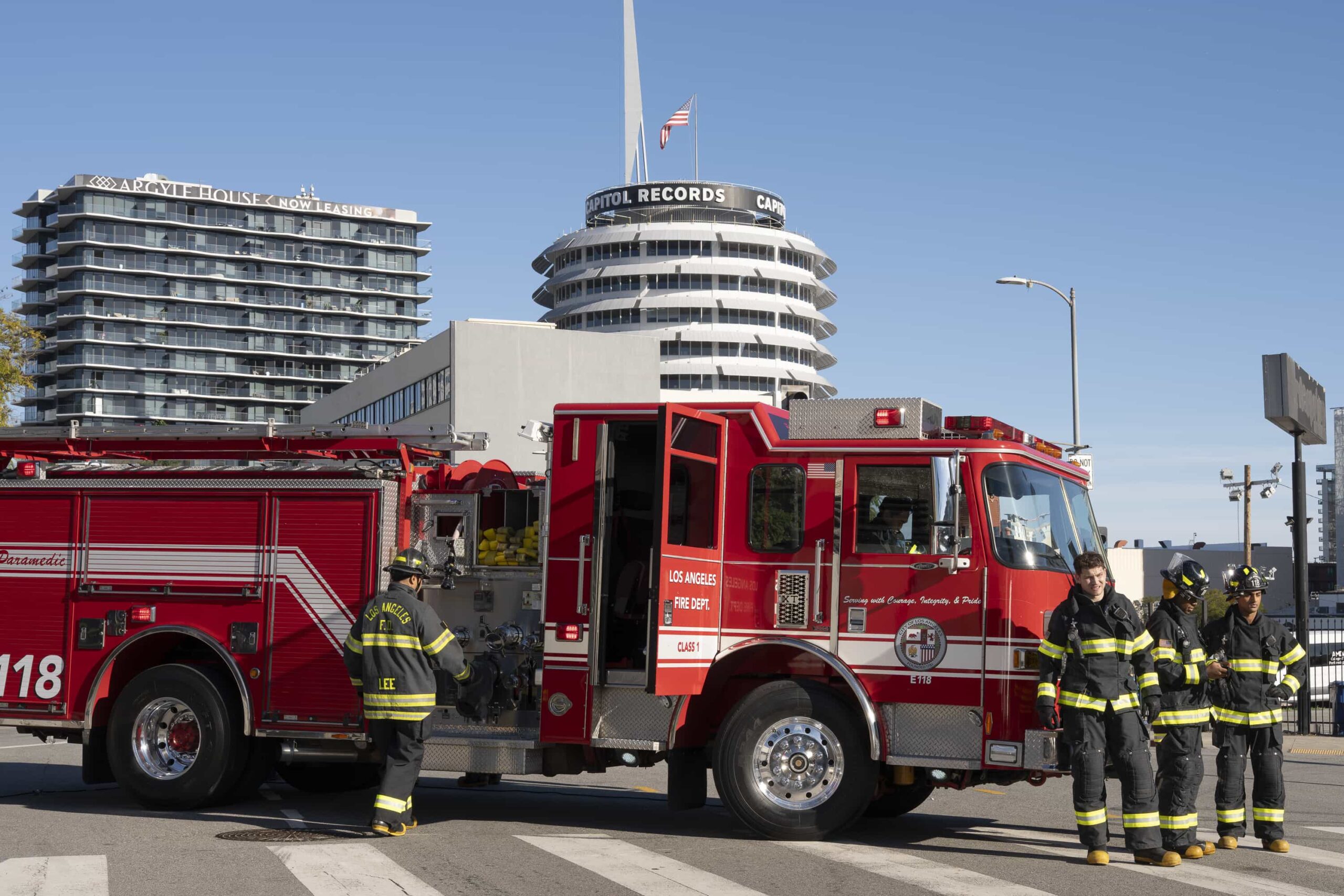 9-1-1 Season 9 Episode 15 Picture - “Pick Your Poison” - Athena is pulled into a mysterious murder investigation when a man arrives at the station to report his own death. Meanwhile, the 118 races to the site of a car crash involving a mother and son. THURSDAY, MARCH 26 (8:00-9:00 p.m. EDT) on ABC.  (Disney/Christopher Willard) 
OLIVER STARK, AISHA HINDS, ANIRUDH PISHARODY