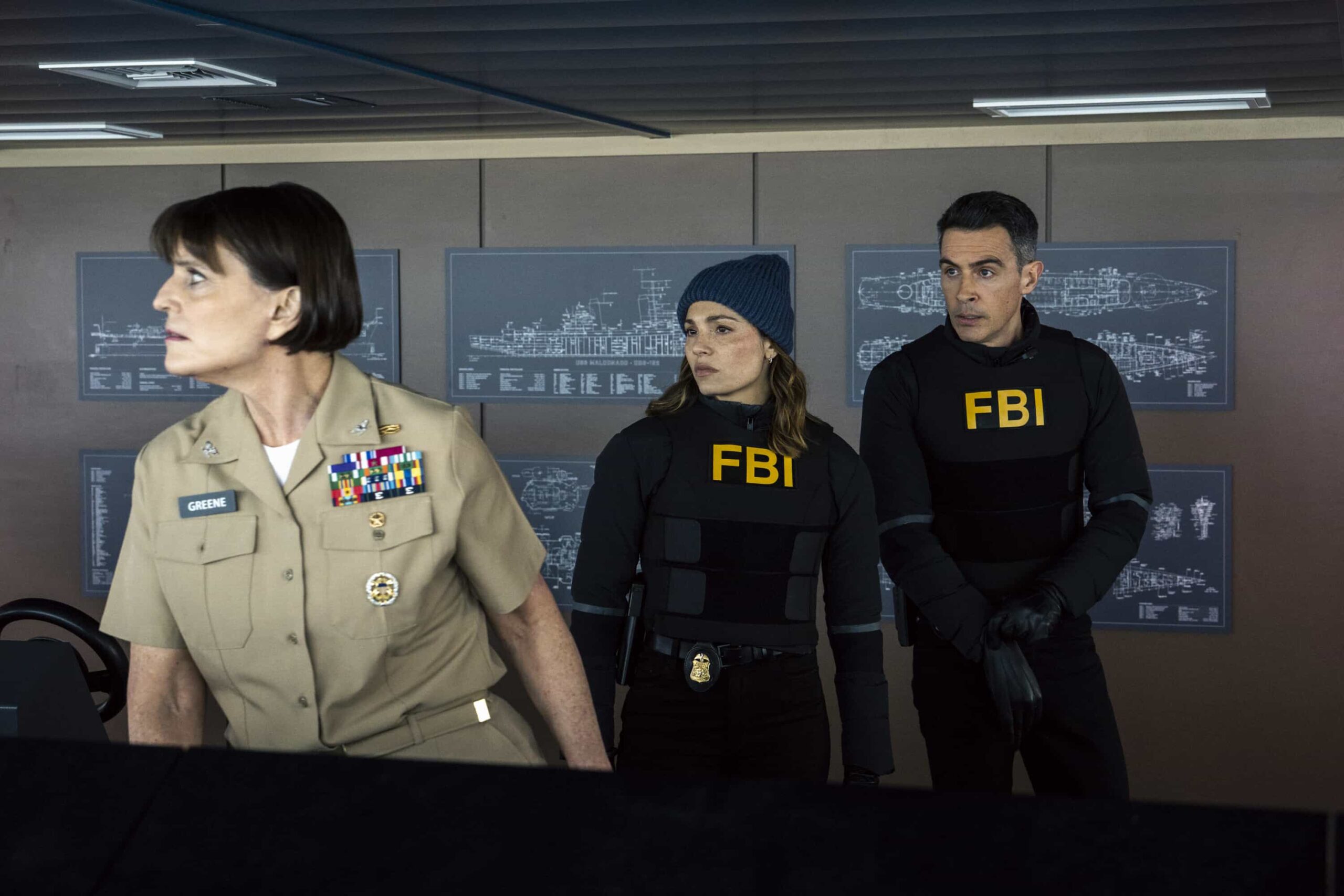 FBI Season 8 Episode 16 Still - “3 Up, 3 Down” – A double homicide in Brooklyn sets the team after a corrupt longshoreman but they soon discover something sinister has been smuggled into NY. As they race to stop the threat, Isobel enlists the help of CIA\'s Deputy Chief of Station Nikki Reynard (Necar Zadegan), on FBI, Monday, March 30 (9:00-10:00 PM, ET/PT). Pictured (L-R): Lisa M. Hodsoll as Captain Hannah Greene, Juliana Aidén Martinez as Eva Ramos and John Boyd as Special Agent Stuart Scola. Photo: Bennett Raglin/CBS ©2026 CBS Broadcasting, Inc. All Rights Reserved.