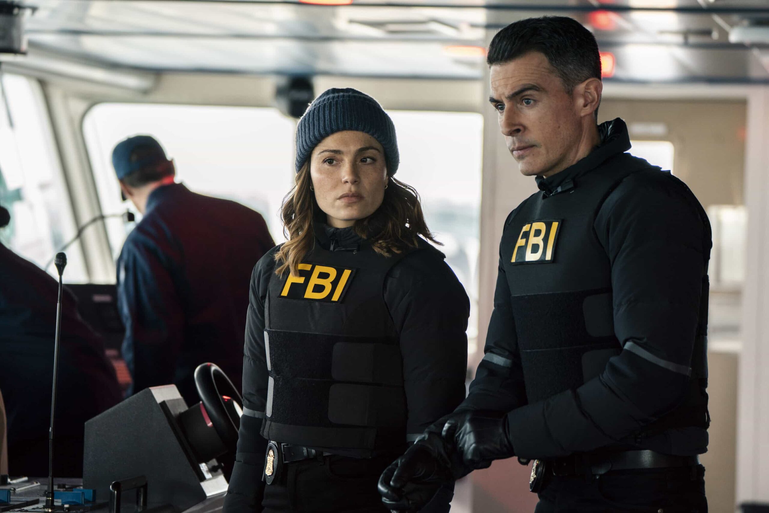 FBI Season 8 Episode 16 - “3 Up, 3 Down” – A double homicide in Brooklyn sets the team after a corrupt longshoreman but they soon discover something sinister has been smuggled into NY. As they race to stop the threat, Isobel enlists the help of CIA\'s Deputy Chief of Station Nikki Reynard (Necar Zadegan), on FBI, Monday, March 30 (9:00-10:00 PM, ET/PT). Pictured (L-R): Juliana Aidén Martinez as Eva Ramos and John Boyd as Special Agent Stuart Scola. Photo: Bennett Raglin/CBS ©2026 CBS Broadcasting, Inc. All Rights Reserved.