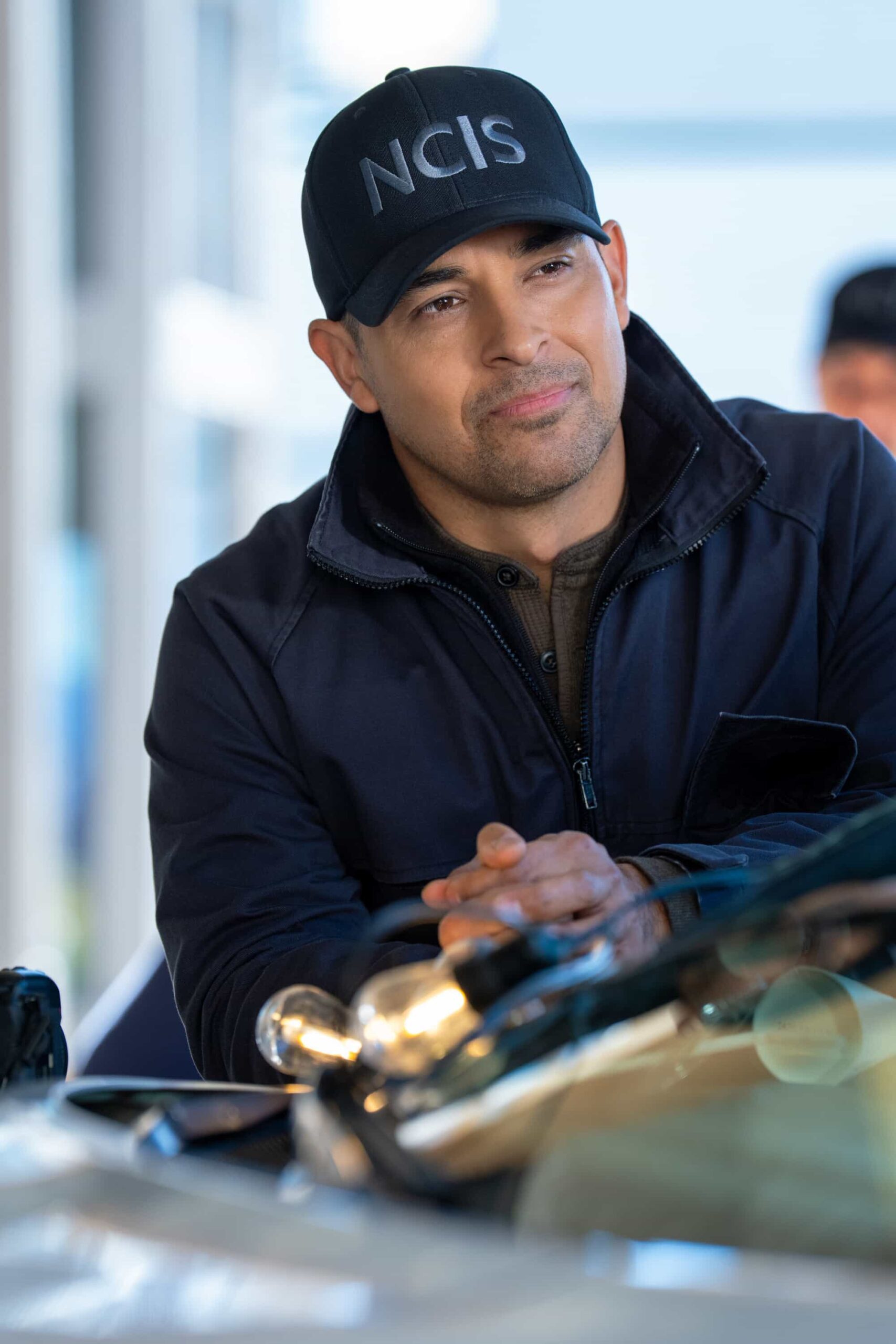 NCIS Season 23 Episode 14 —  “Fleeting” – Navy Week turns electric when a stolen squad car flips and reveals a sailor stabbed in the trunk. As D.C. spirals into chaos, the team chases a killer while carrying the weight of recent events, on the CBS Original series NCIS, Tuesday, March 31 (8:00-9:00 PM, ET/PT) on the CBS Television Network    Pictured (L-R): SWilmer Valderrama as Nick Torres        Photo: Robert Voets/CBS ©20256CBS Broadcasting, Inc. All Rights Reserved.