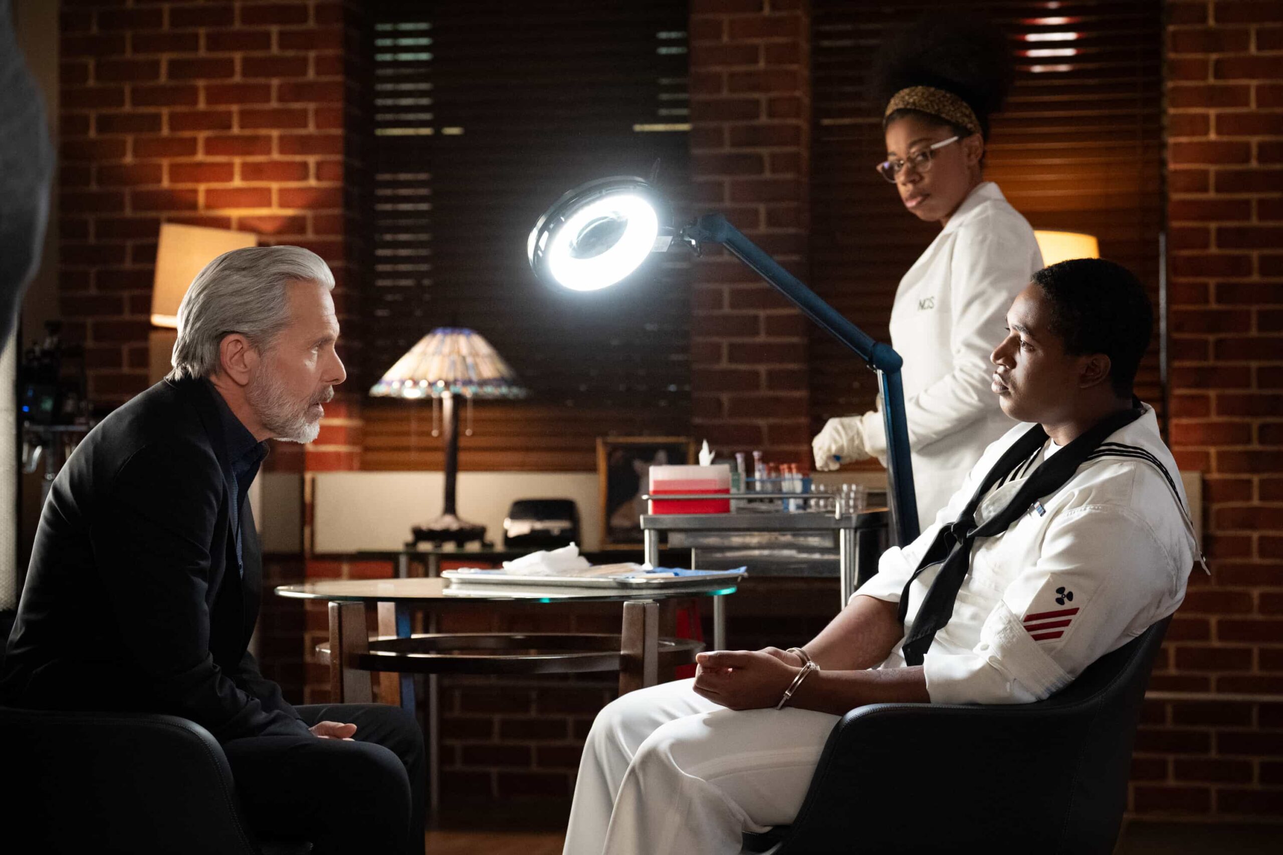 NCIS Season 23 Episode 14 —  “Fleeting” – Navy Week turns electric when a stolen squad car flips and reveals a sailor stabbed in the trunk. As D.C. spirals into chaos, the team chases a killer while carrying the weight of recent events, on the CBS Original series NCIS, Tuesday, March 31 (8:00-9:00 PM, ET/PT) on the CBS Television Network    Pictured (L-R): Gary Cole as Alden Parker and Diona Reasonover as Kasie Hines.        Photo: Robert Voets/CBS ©20256CBS Broadcasting, Inc. All Rights Reserved.