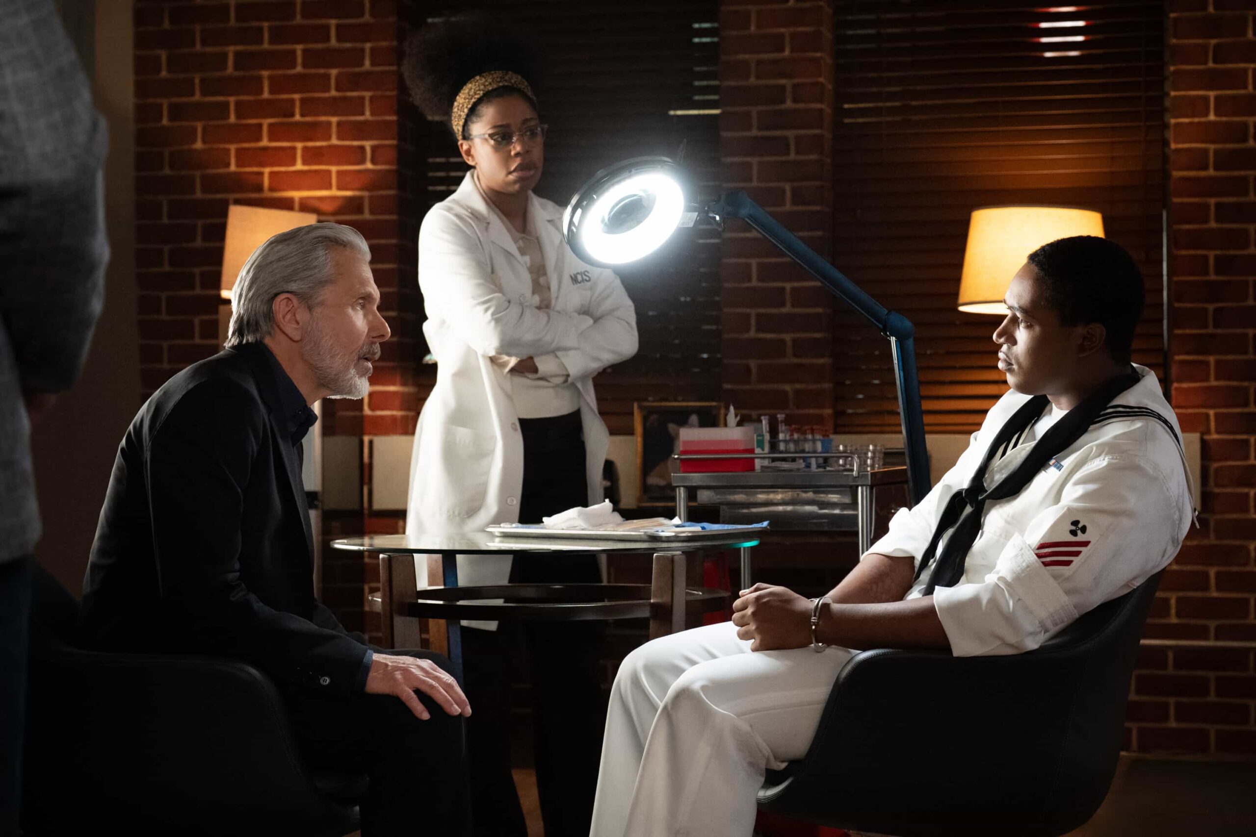 NCIS Season 23 Episode 14 —  “Fleeting” – Navy Week turns electric when a stolen squad car flips and reveals a sailor stabbed in the trunk. As D.C. spirals into chaos, the team chases a killer while carrying the weight of recent events, on the CBS Original series NCIS, Tuesday, March 31 (8:00-9:00 PM, ET/PT) on the CBS Television Network    Pictured (L-R): Gary Cole as Alden Parker and Diona Reasonover as Kasie Hines.        Photo: Robert Voets/CBS ©20256CBS Broadcasting, Inc. All Rights Reserved.