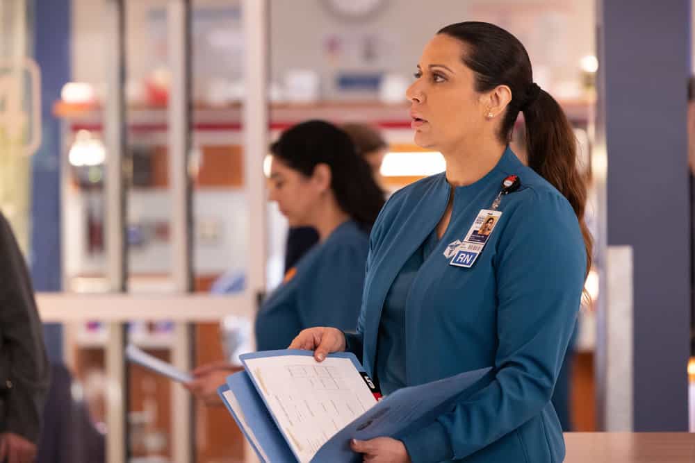 CHICAGO MED Season 11 Episode 16 Promo -- "The Book of Charles" Episode 1115 -- Pictured: Lorena Diaz as Doris Perez -- (Photo by: George Burns Jr/NBC)