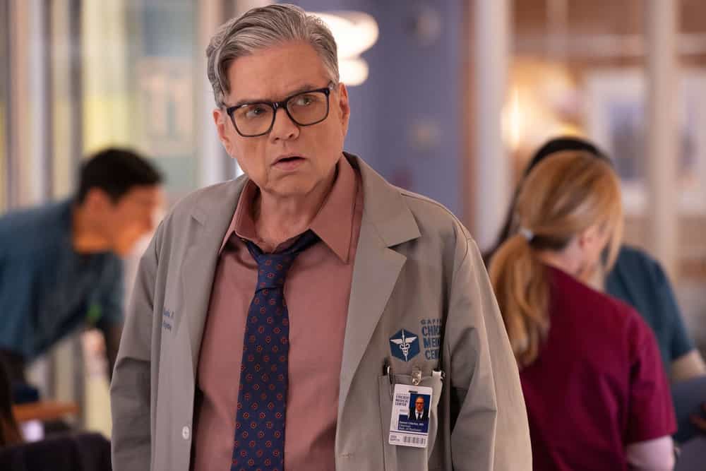 CHICAGO MED Season 11 Episode 16 Photo -- "The Book of Charles" Episode 1115 -- Pictured: Oliver Platt as Dr. Daniel Charles -- (Photo by: George Burns Jr/NBC)