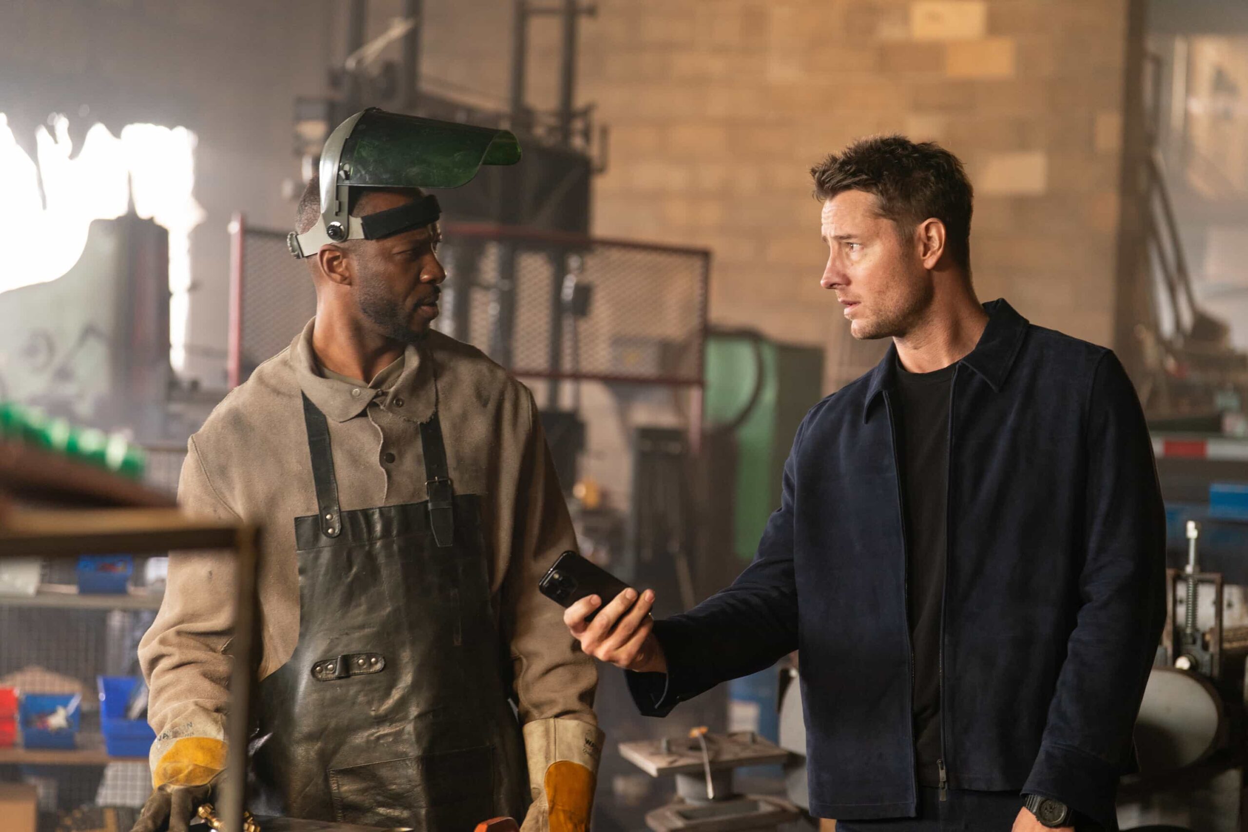 Tracker Season 3 Episode 15 "No Good Deed" -- Coverage of the CBS Original Series TRACKER, scheduled to air on the CBS Television Network.  Pictured: Reggie Watkins as Bill and Justin Hartley as Colter Shaw. Photo: Darko Sikman/CBS ©2026 CBS Broadcasting, Inc. All Rights Reserved.