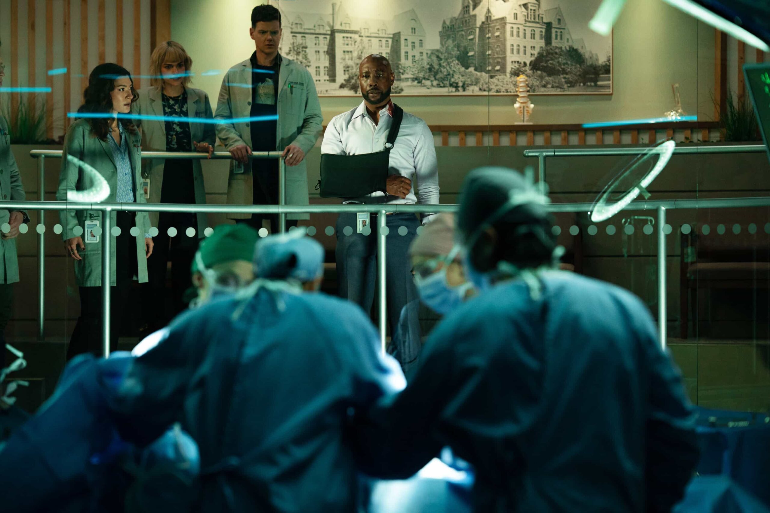 Watson Season 2 Episode 17 Promo - "Unsolved Mysteries" -- Coverage of the CBS Original Series WATSON, scheduled to air on the CBS Television Network.   Pictured (L-R): Inga Schlingmann as Dr. Sasha Lubbock, Eve Harlow as Dr. Ingrid Derian, Peter Mark Kendall as Dr. Adam Croft, and Morris Chestnut as Dr. John Watson    Photo: Colin Bentley/CBS ©2026 CBS Broadcasting, Inc. All Rights Reserved.