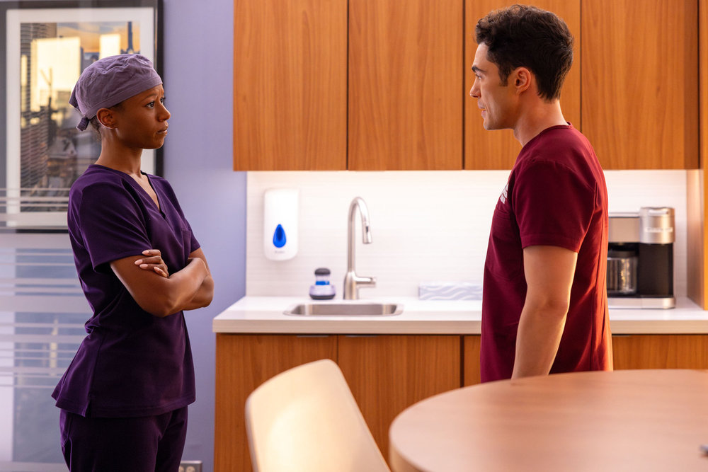 Chicago Med Season 11 Episode 18 -- "Things Left Unsaid" Episode 1118 -- Pictured: (l-r) Ashlei Sharpe Chestnut as Dr. Naomi Howard, Darren Barnet as Dr. John Frost -- (Photo by: George Burns Jr/NBC)