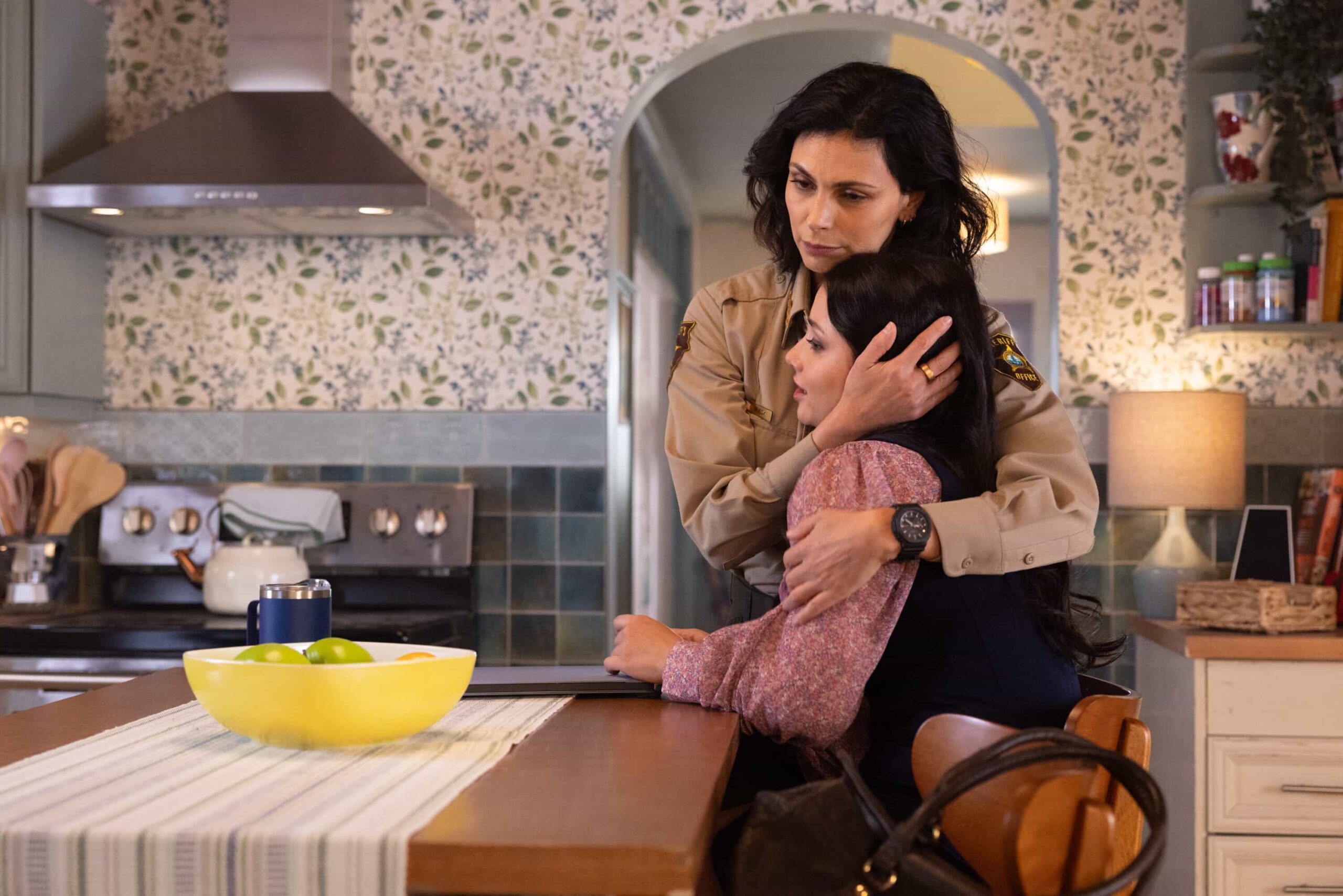 “Twenty Four Candles” – While Skye celebrates her 24th birthday, Sheriff Mickey Fox investigates a brutal attack tied to a land-grab scheme, on SHERIFF COUNTRY, Friday, April 24. Pictured: Morena Baccarin as Sheriff Mickey Fox and Amanda Arcuri as Skye Fraley. Photo: Darren Goldstein/CBS ©2025 CBS Broadcasting, Inc. All Rights Reserved.