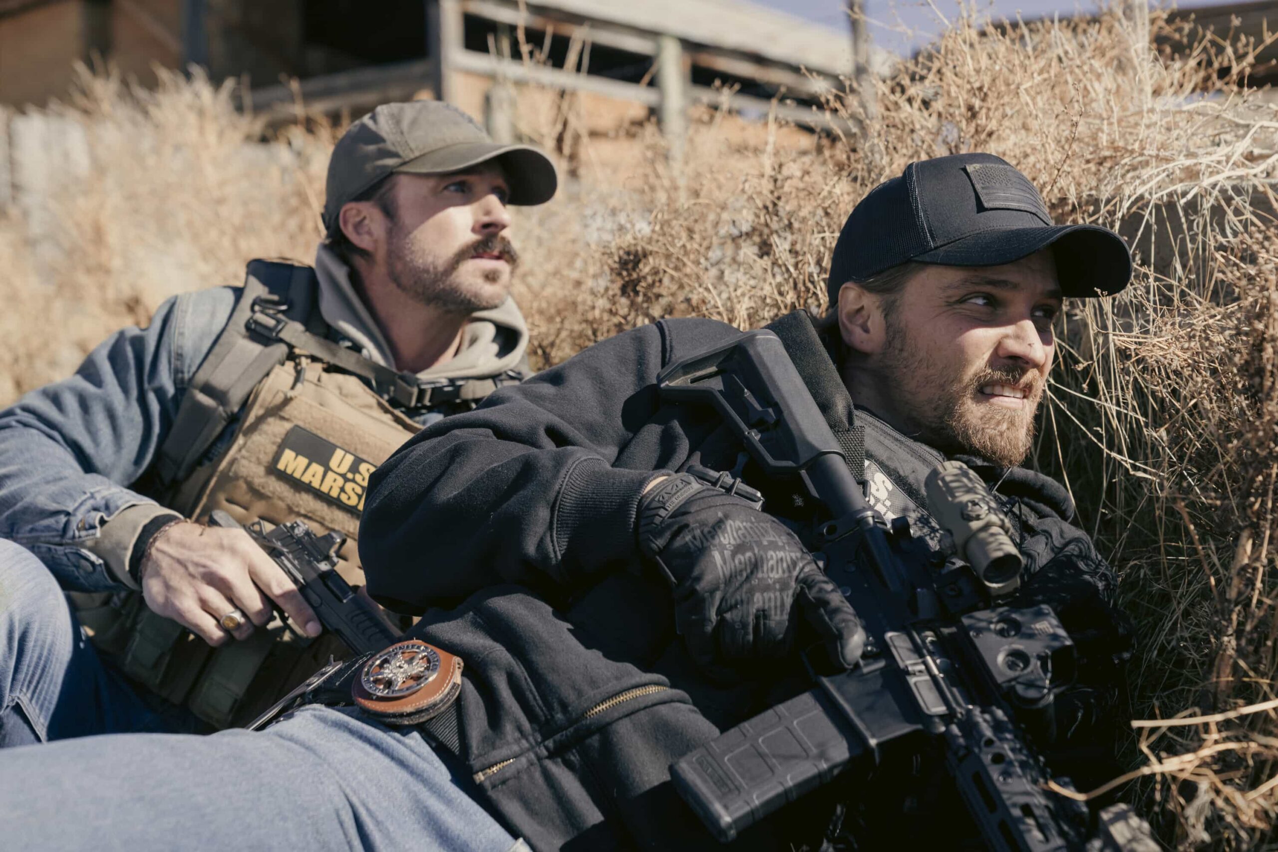 "In Low Places" -- CBS Original Series MARSHALS, scheduled to air on Sunday, April 26 (8:00-9:00 PM, ET/PT).  Pictured (L-R): Riley Green as Garrett and Luke Grimes as Kayce Dutton. Photo: Cam McLeod/CBS ©2025 CBS Broadcasting, Inc. All Rights Reserved.