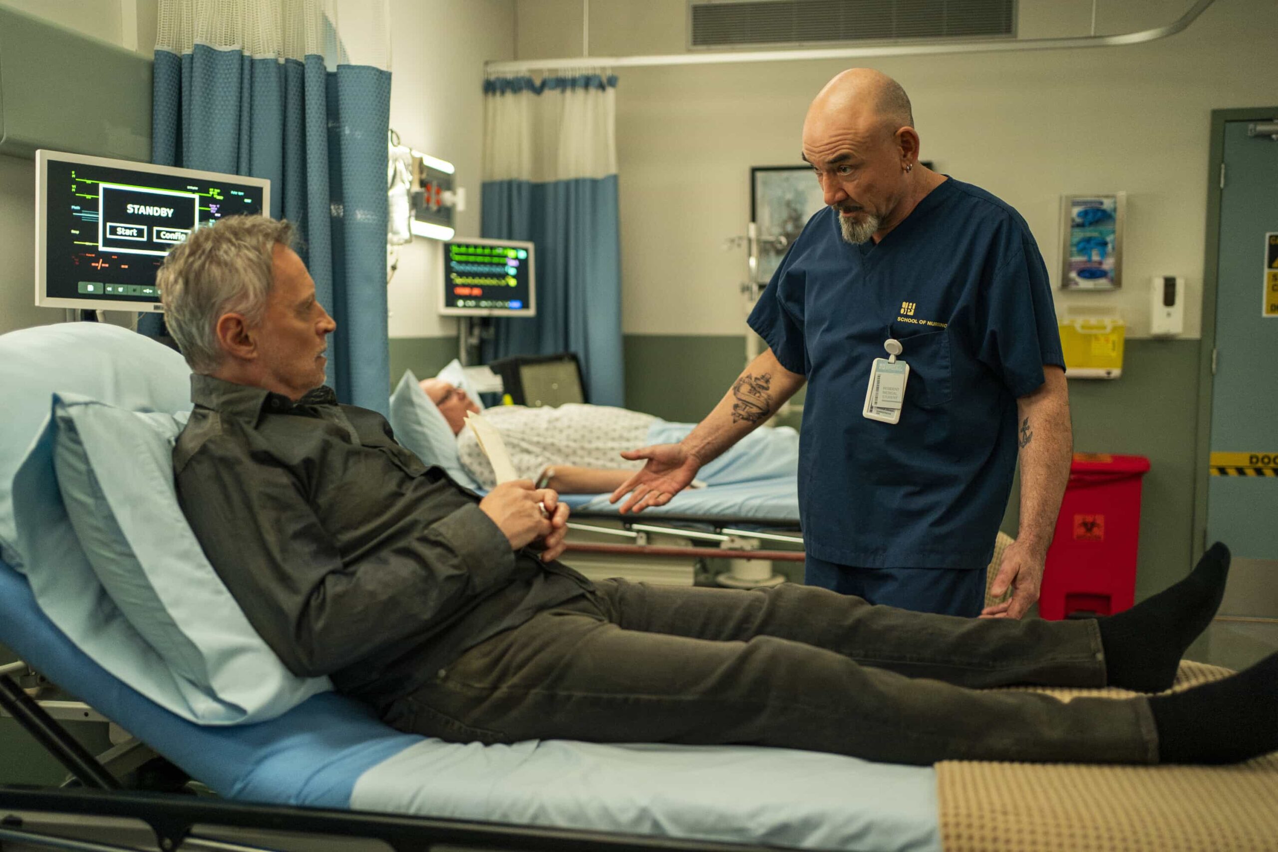 Watson Season 2 Episode 19 "The Rule of Three" -- Coverage of the CBS Original Series WATSON, scheduled to air on the CBS Television Network. Pictured L to R: and Ritchie Coster as Shinwell Johnson. Photo: Colin Bentley/CBS ©2026 CBS Broadcasting, Inc. All Rights Reserved.