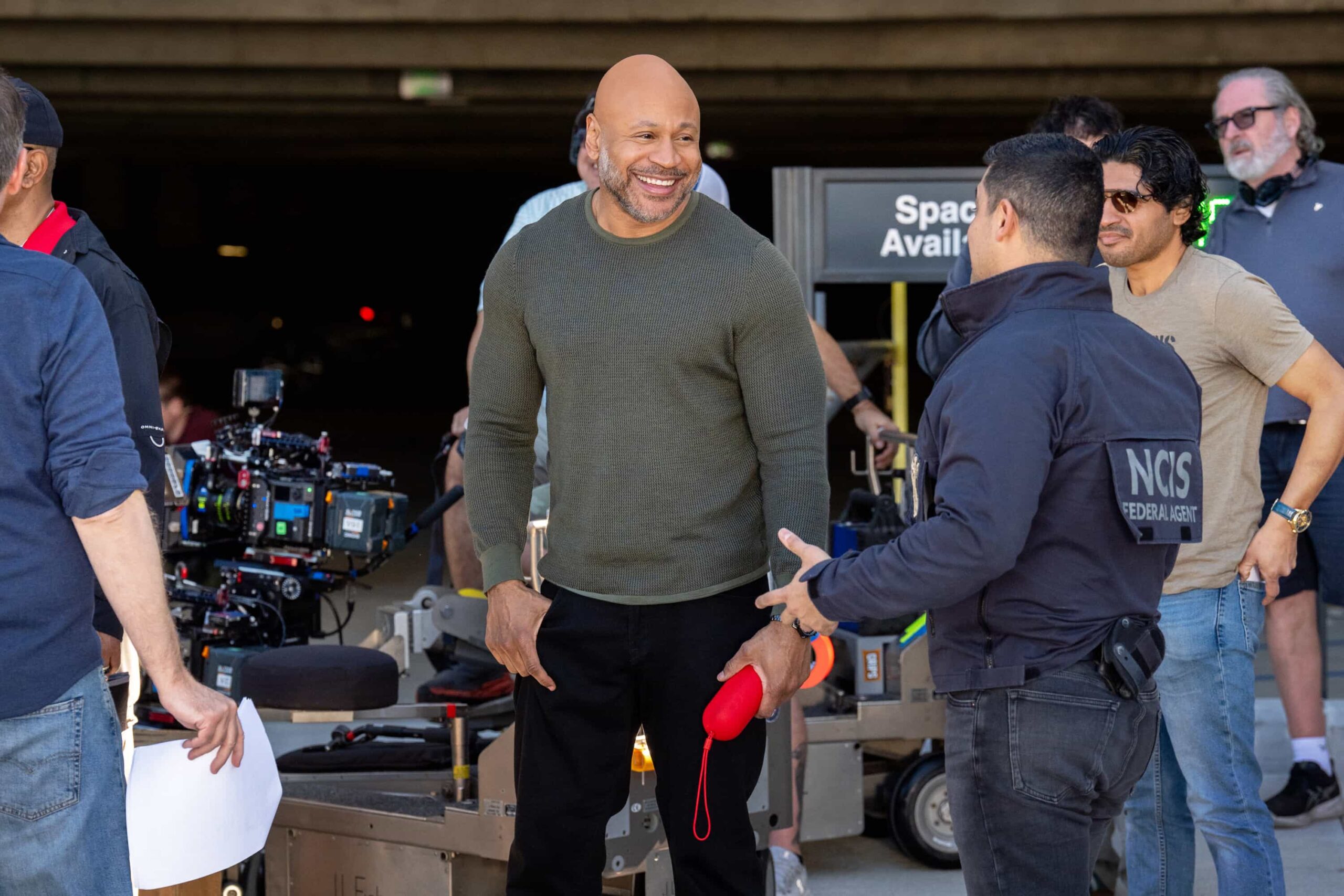 NCIS Season 23 Episode 18 Behind The Scenes “BAD IMPRESSIONS” - CBS Original Series NCIS, scheduled to air TUESDAY, APRIL 28 (8:00 PM ET/PT)    Pictured (L-R): LL COOL J as Sam Hanna and Wilmer Valderrama as Nick Torres  Photo: Robert Voets/CBS   ©2026 CBS Broadcasting, Inc. All Rights Reserved.
