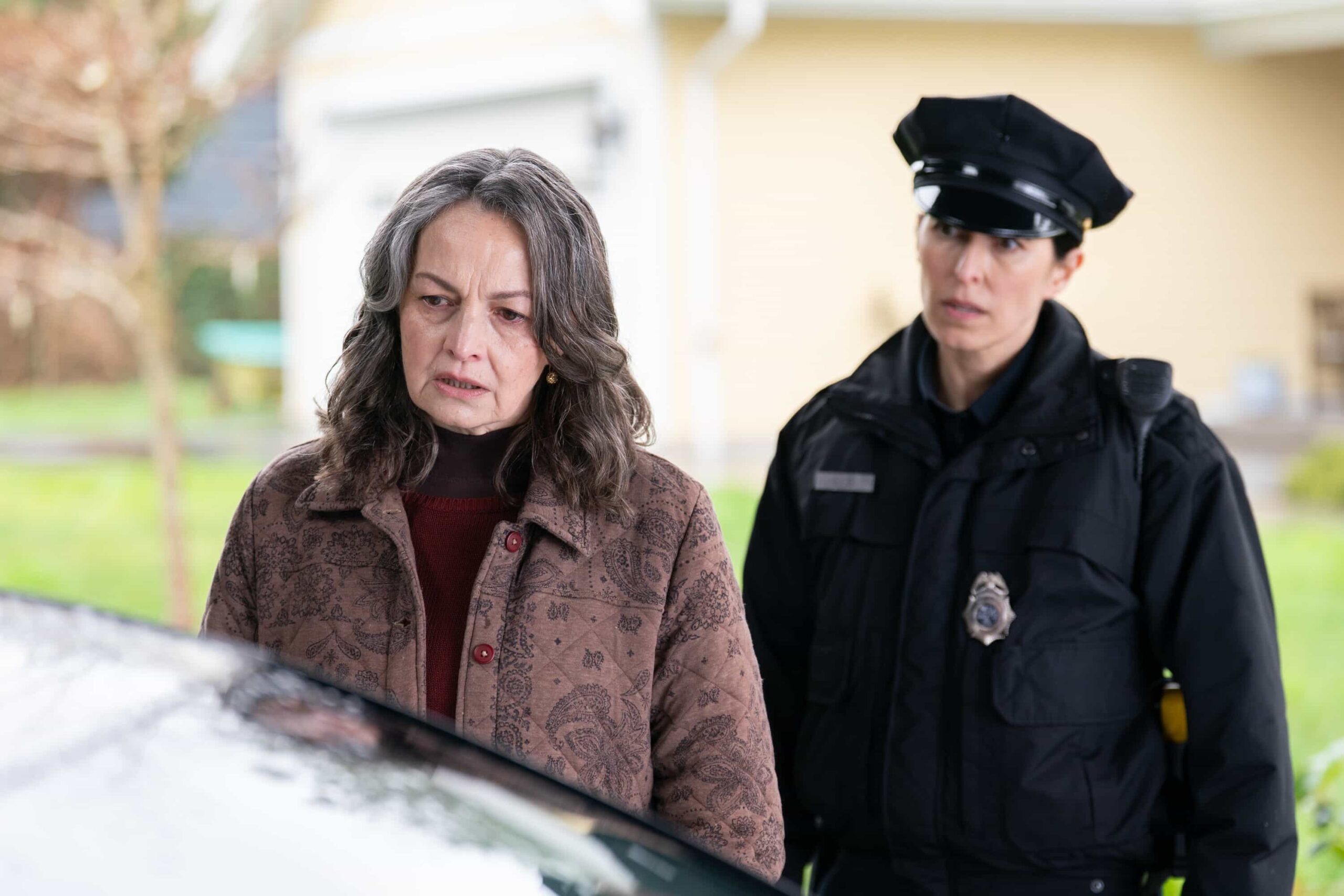 Tracker Season 3 Episode 19 “Chain of Custody” – Reenie hires Colter to locate the star witness of her and Maxine’s lawsuit against a corrupt real estate developer on the eve of trial, on the CBS Original series TRACKER, Sunday, May 3 (8:59-9:59 PM, ET/PT) on the CBS Television Network, and streaming on Paramount+  Pictured: Karrie Drake as Sienna Grimmer and Joanna Gaskell as Officer Lee.  Photo: Darko Sikman/CBS ©2026 CBS Broadcasting, Inc. All Rights Reserved.