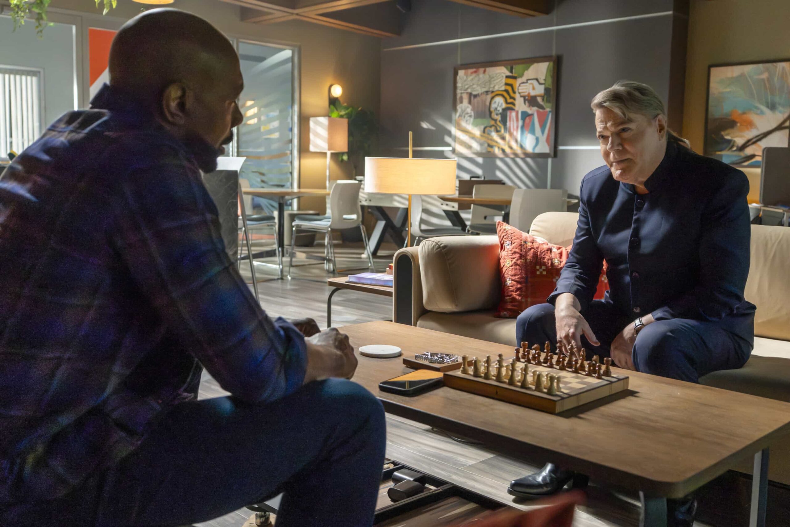 Watson Season 2 Episode 20 Series Finale  "The Cobalt Fissure" -- Coverage of the CBS Original Series WATSON, scheduled to air on the CBS Television Network. Pictured L to R: Morris Chestnut as Dr. John Watson and Eddie Izzard as Sebastian Moran. Photo: Colin Bentley/CBS ©2026 CBS Broadcasting, Inc. All Rights Reserved.