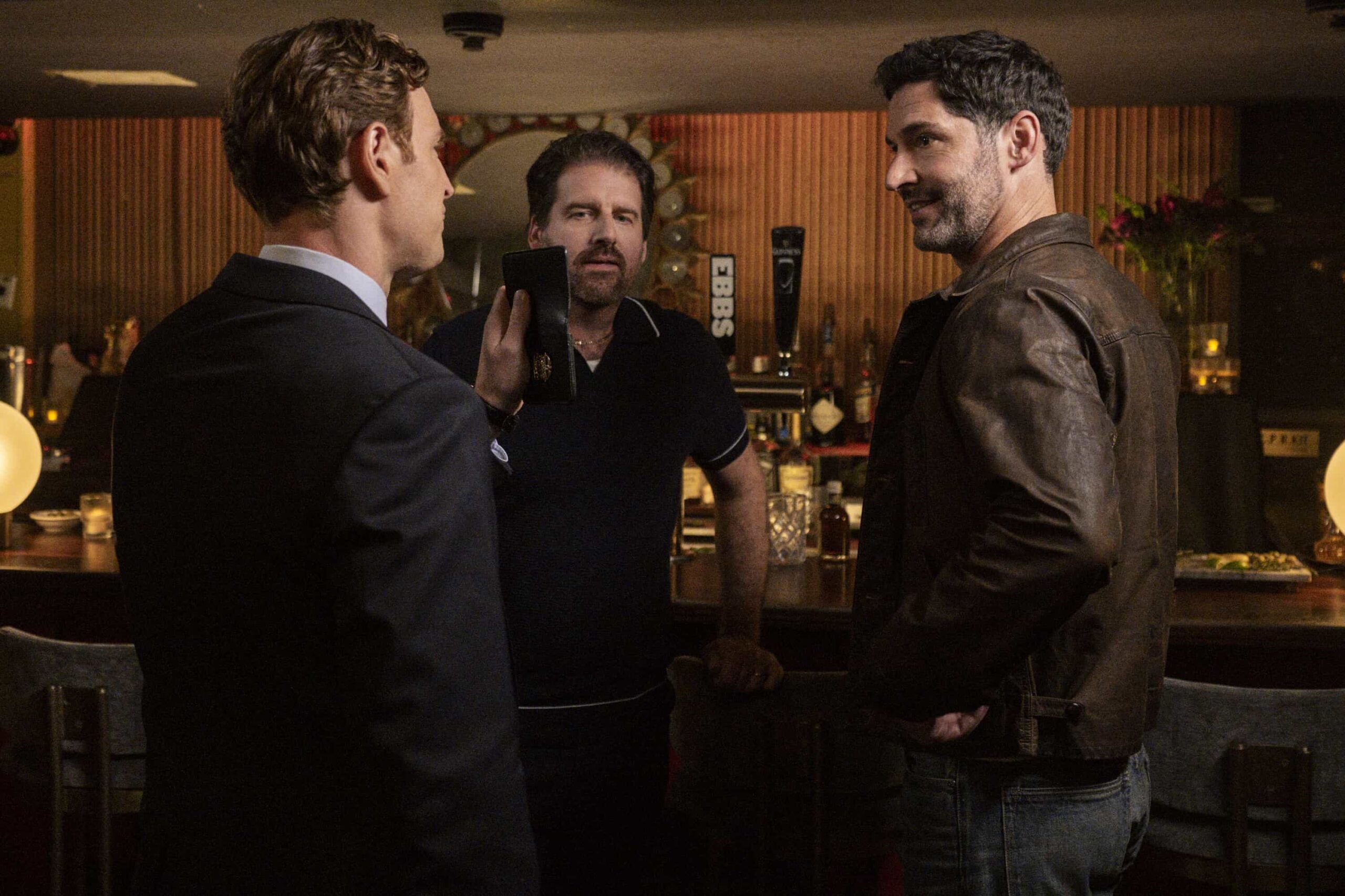"Rare Earth" -- CBS Original Series CIA, scheduled to air on Monday, May 4 (10:00-11:00 PM, ET/PT).  Pictured (L-R): Bryan Langlitz as Bar Owner and Tom Ellis as CIA Case Officer Colin Glass. Photo: Mark Schafer/CBS ©2025 CBS Broadcasting, Inc. All Rights Reserved.